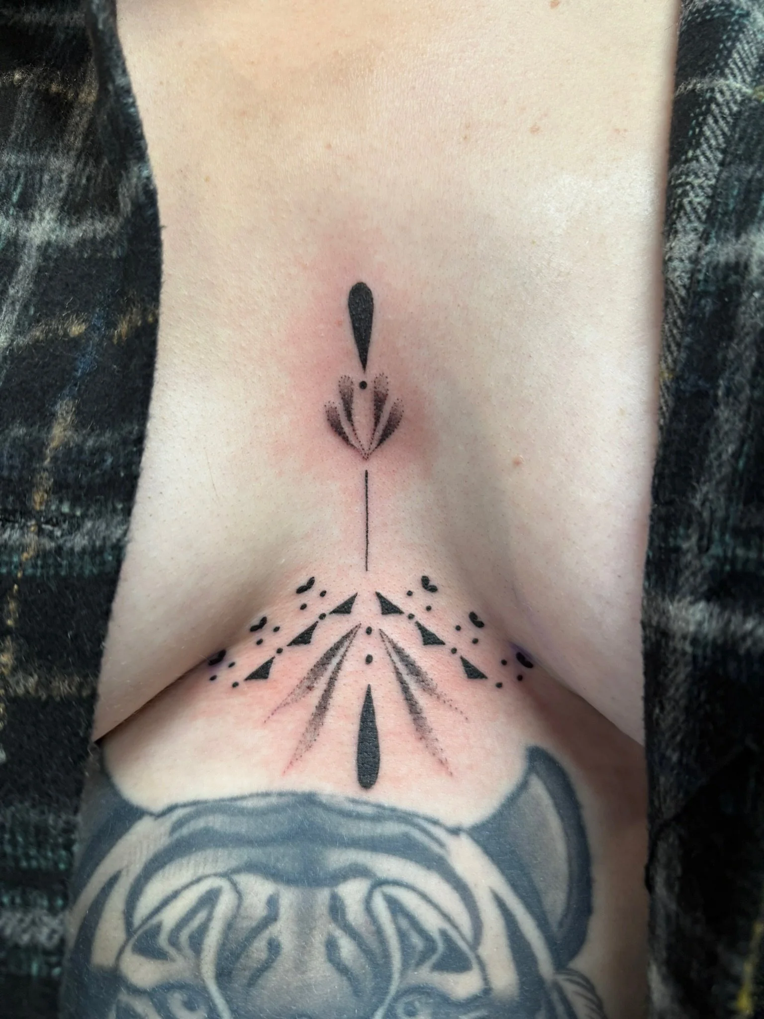 Fine line tattoo on the sternum by Leah Fries, located at Moth to a Flame Tattoo, Colorado Springs