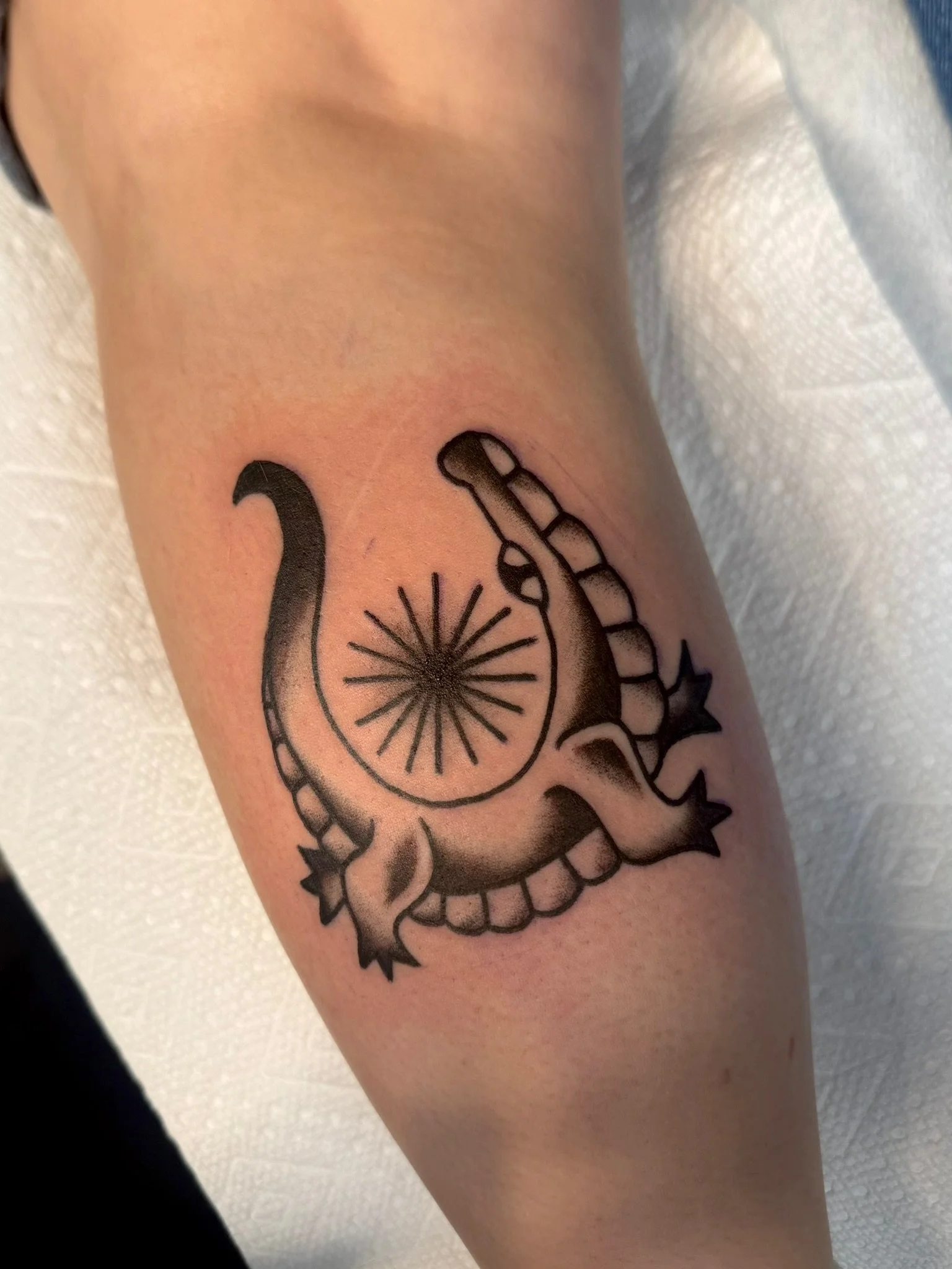 Folk style tattoo of an alligator in black and gray ink by Leah Fries, located at Moth to a Flame Tattoo, Colorado Springs