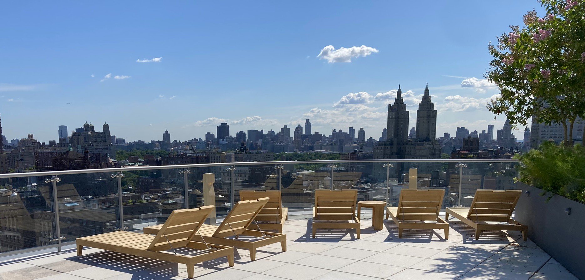 Rooftop lounge space with outdoor chaise lounge chairs. Upper West Side NYC Landscape Design