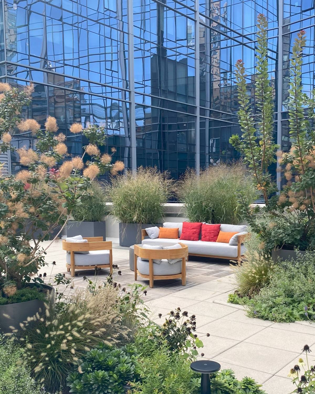 Rooftop garden with modern wood furniture in NYC