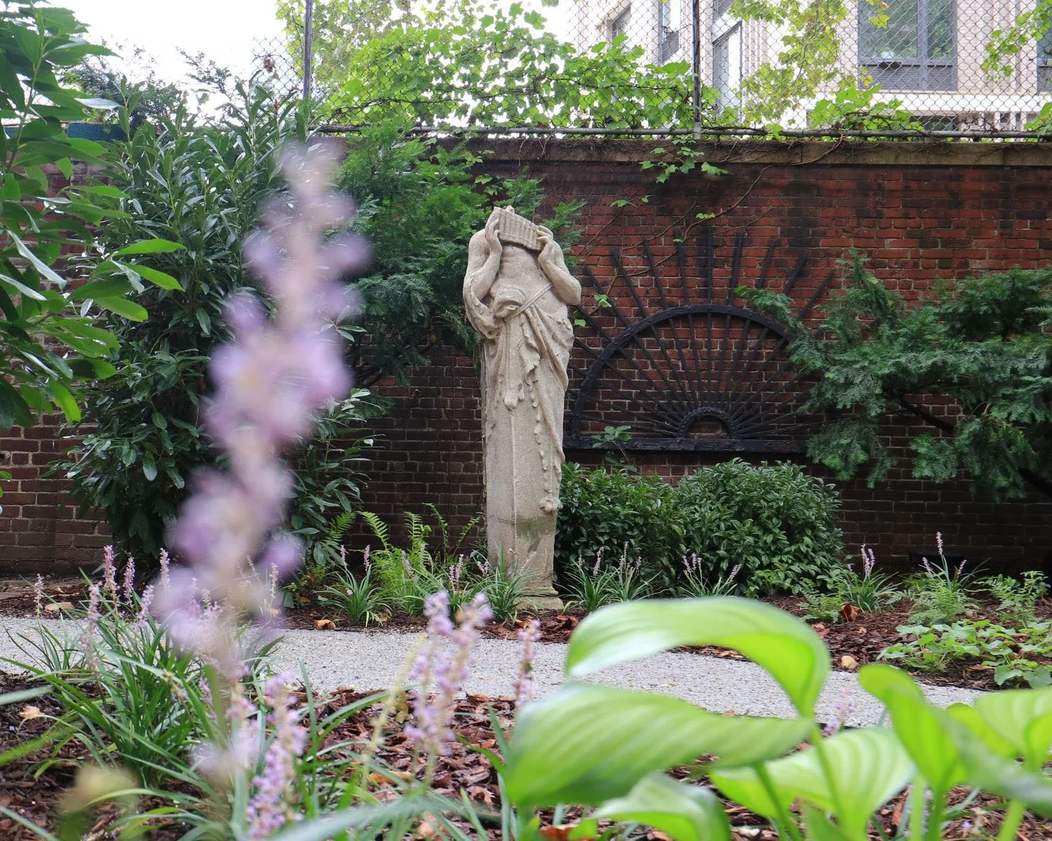 Traditional courtyard statue design, into a shade garden
