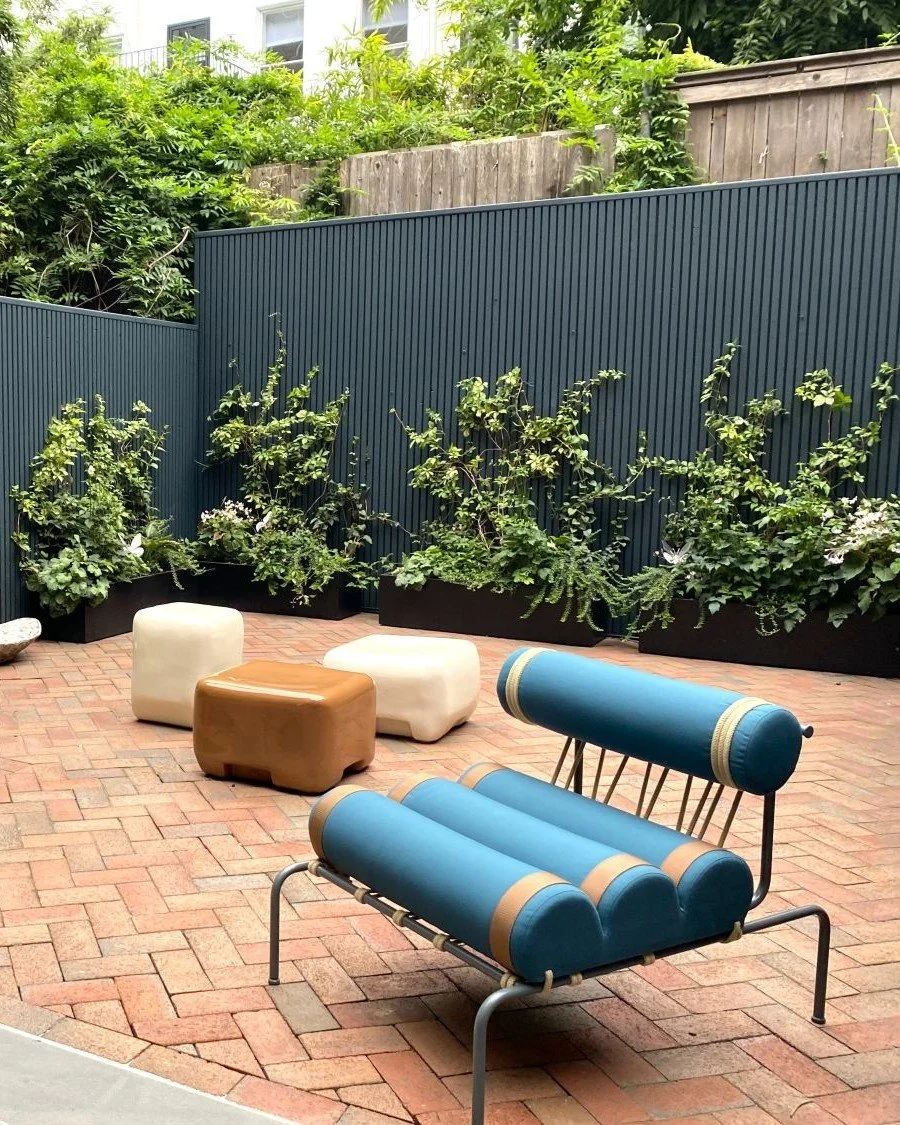 Modern backyard landscape design with brick patio