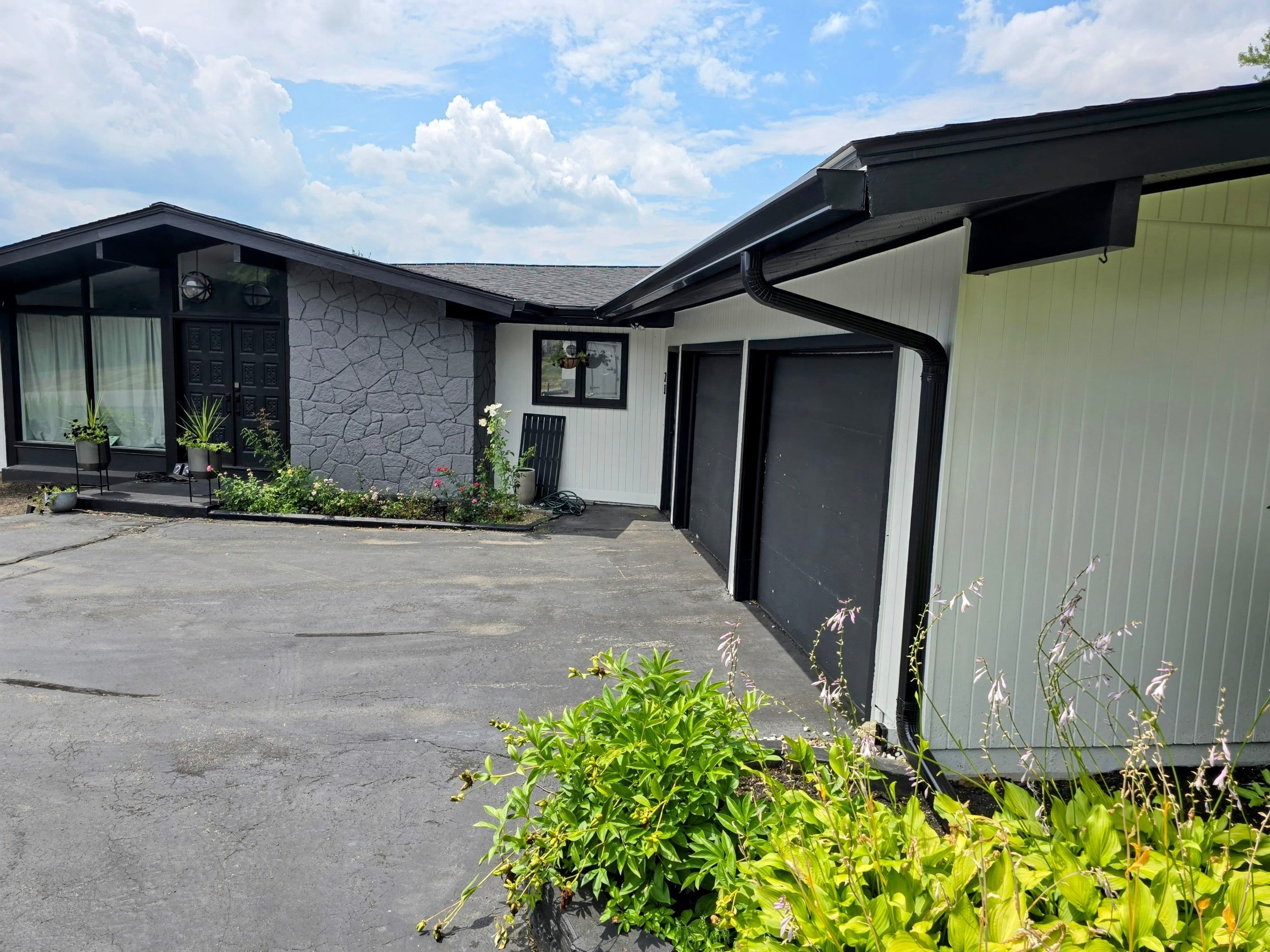 Sleek Black Seamless Gutter Installation in Leominster, MA