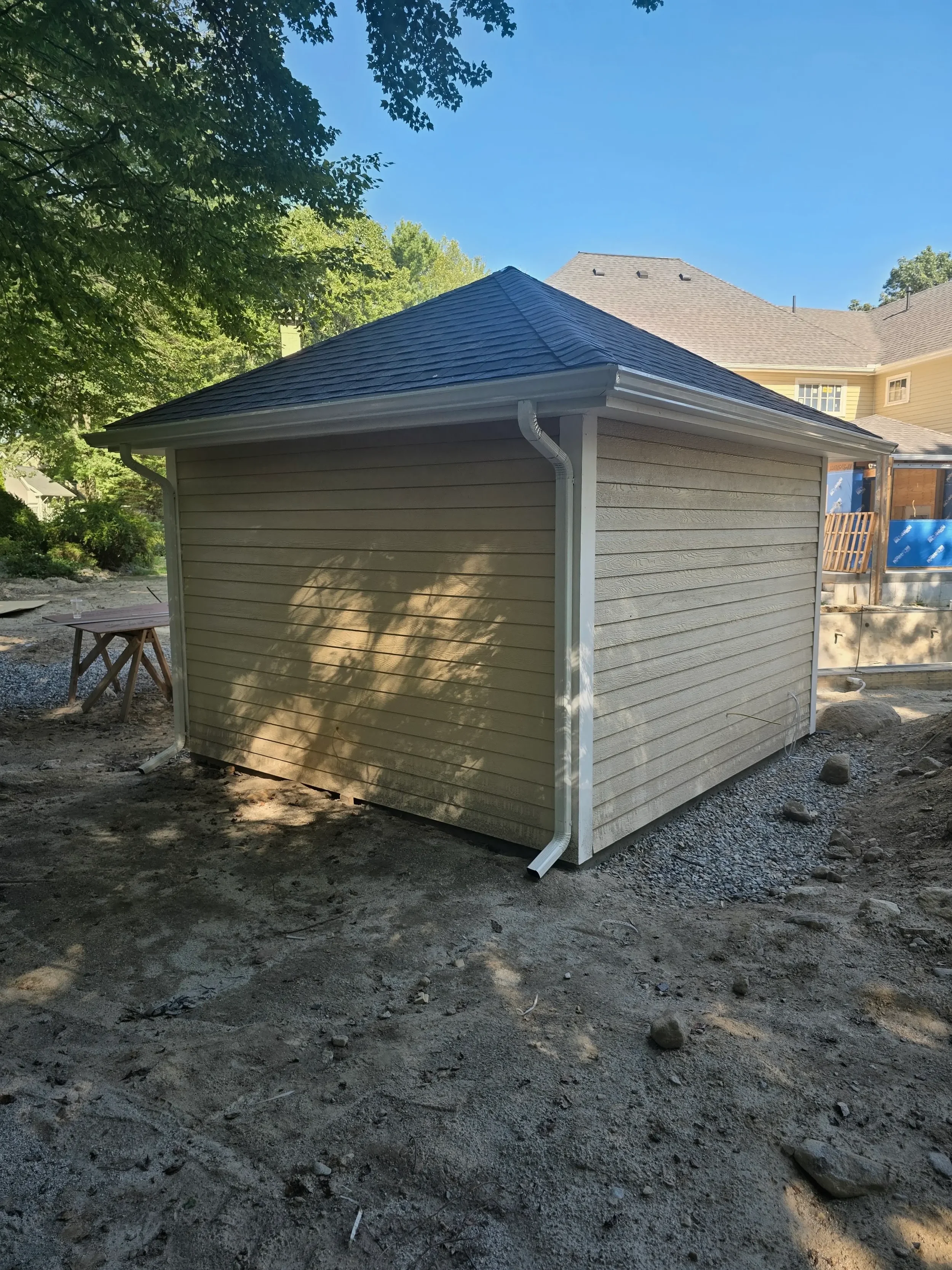 365ft of white 5-inch .032-gauge aluminum seamless gutters with hidden hangers, micro-mesh gutter screening, 2x3 downspouts, and (14) miters in Shrewsbury, MA | Royalty Gutters LLC