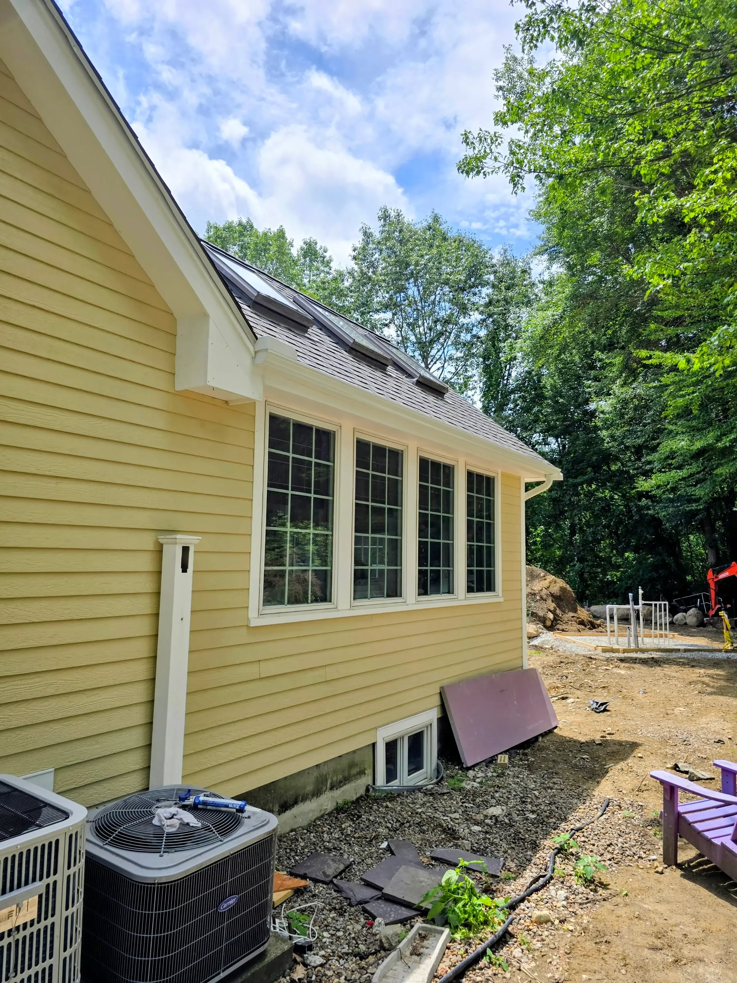 365ft of white 5-inch .032-gauge aluminum seamless gutters with hidden hangers, micro-mesh gutter screening, 2x3 downspouts, and (14) miters in Shrewsbury, MA | Royalty Gutters LLC