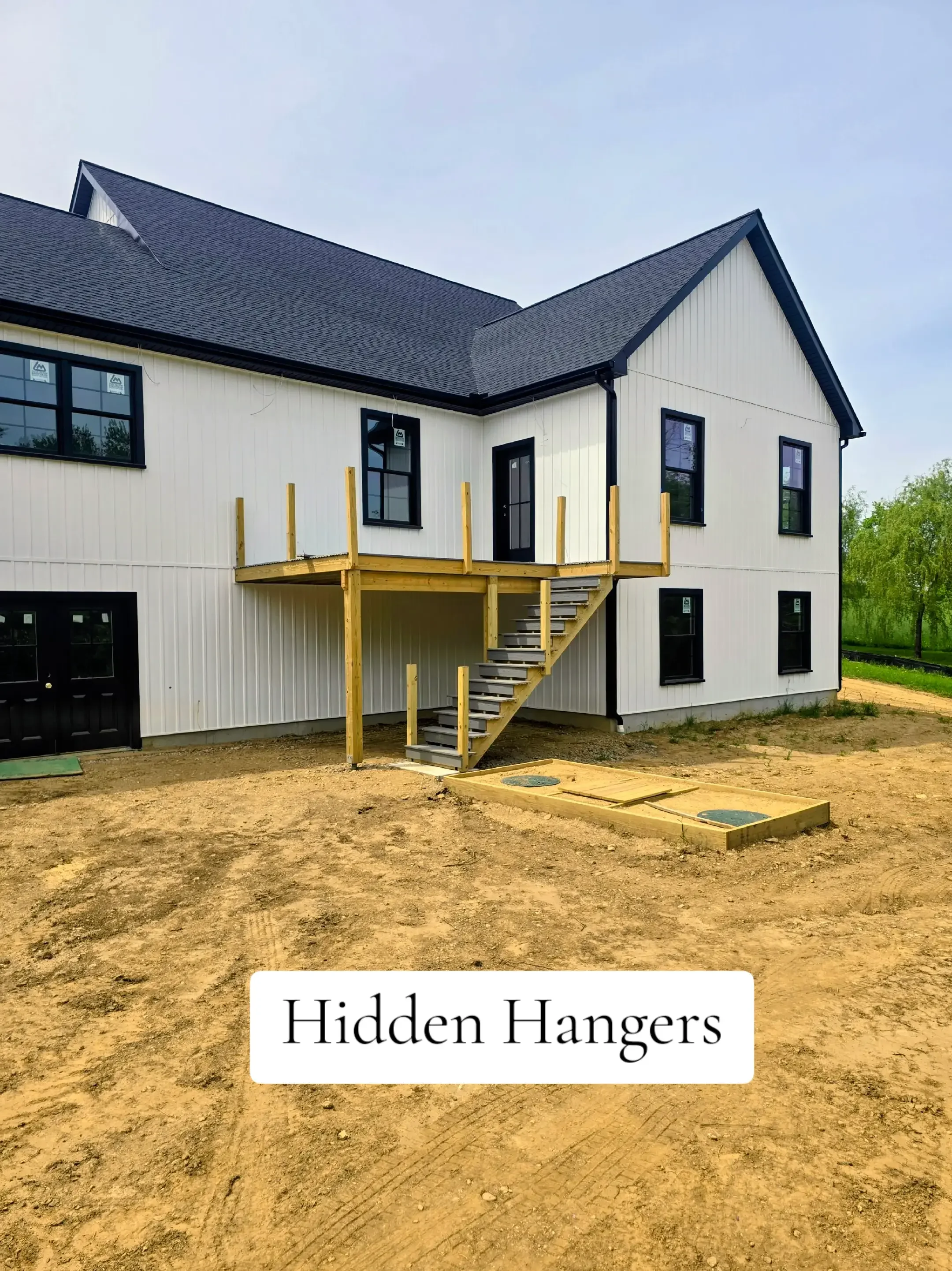  5" black .032-gauge aluminum seamless gutters Hidden hangers for superior strength and a clean finish Black 2x3 downspouts 2 custom inside miters in North Brookfield, MA Royalty Gutters LLC 2026