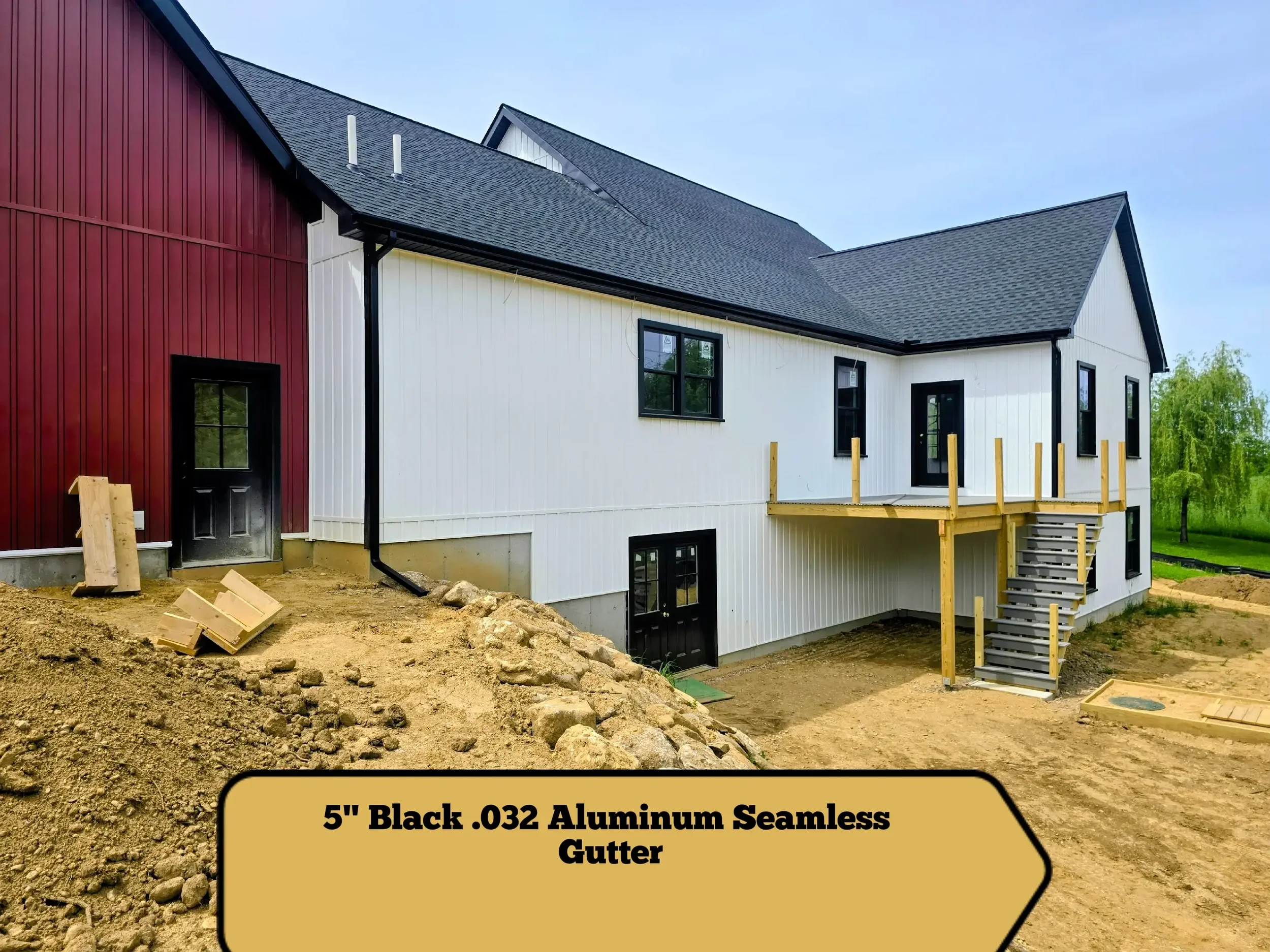  5" black .032-gauge aluminum seamless gutters Hidden hangers for superior strength and a clean finish Black 2x3 downspouts 2 custom inside miters in North Brookfield, MA Royalty Gutters LLC 2026