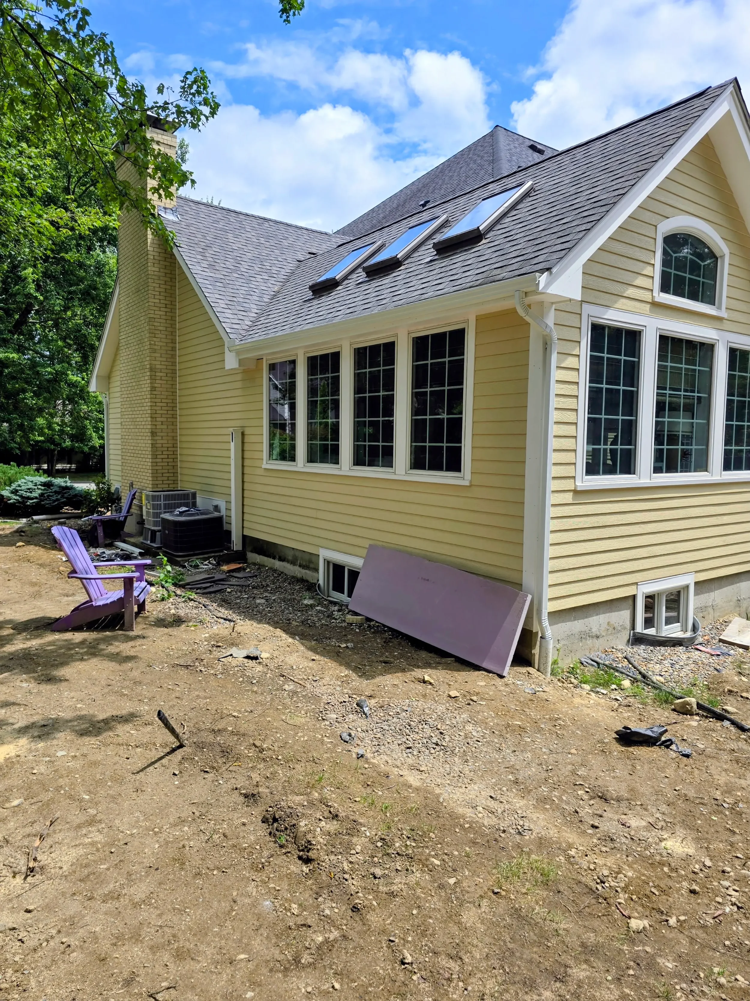 365ft of white 5-inch .032-gauge aluminum seamless gutters with hidden hangers, micro-mesh gutter screening, 2x3 downspouts, and (14) miters in Shrewsbury, MA | Royalty Gutters LLC
