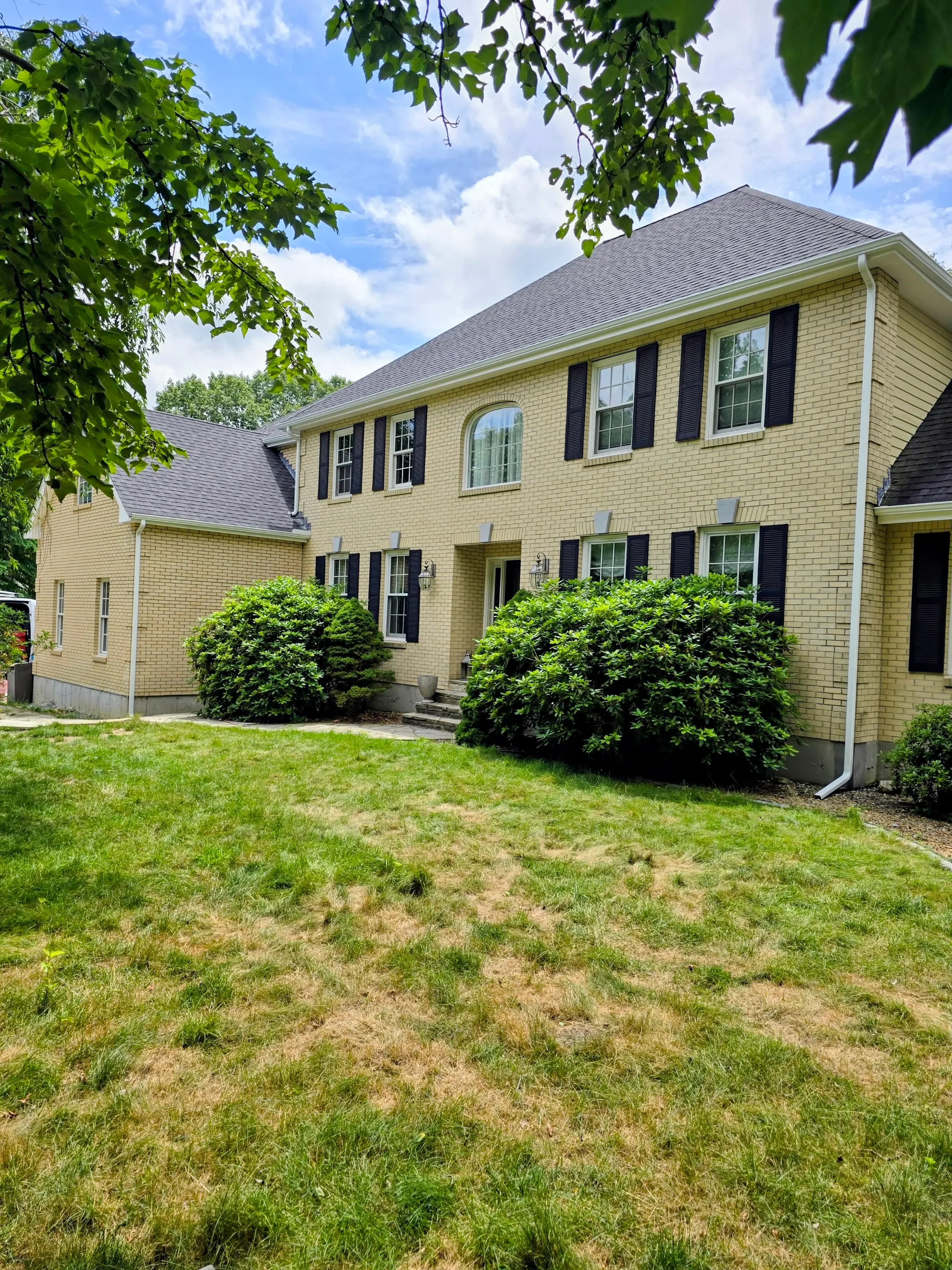 365ft of white 5-inch .032-gauge aluminum seamless gutters with hidden hangers, micro-mesh gutter screening, 2x3 downspouts, and (14) miters in Shrewsbury, MA | Royalty Gutters LLC