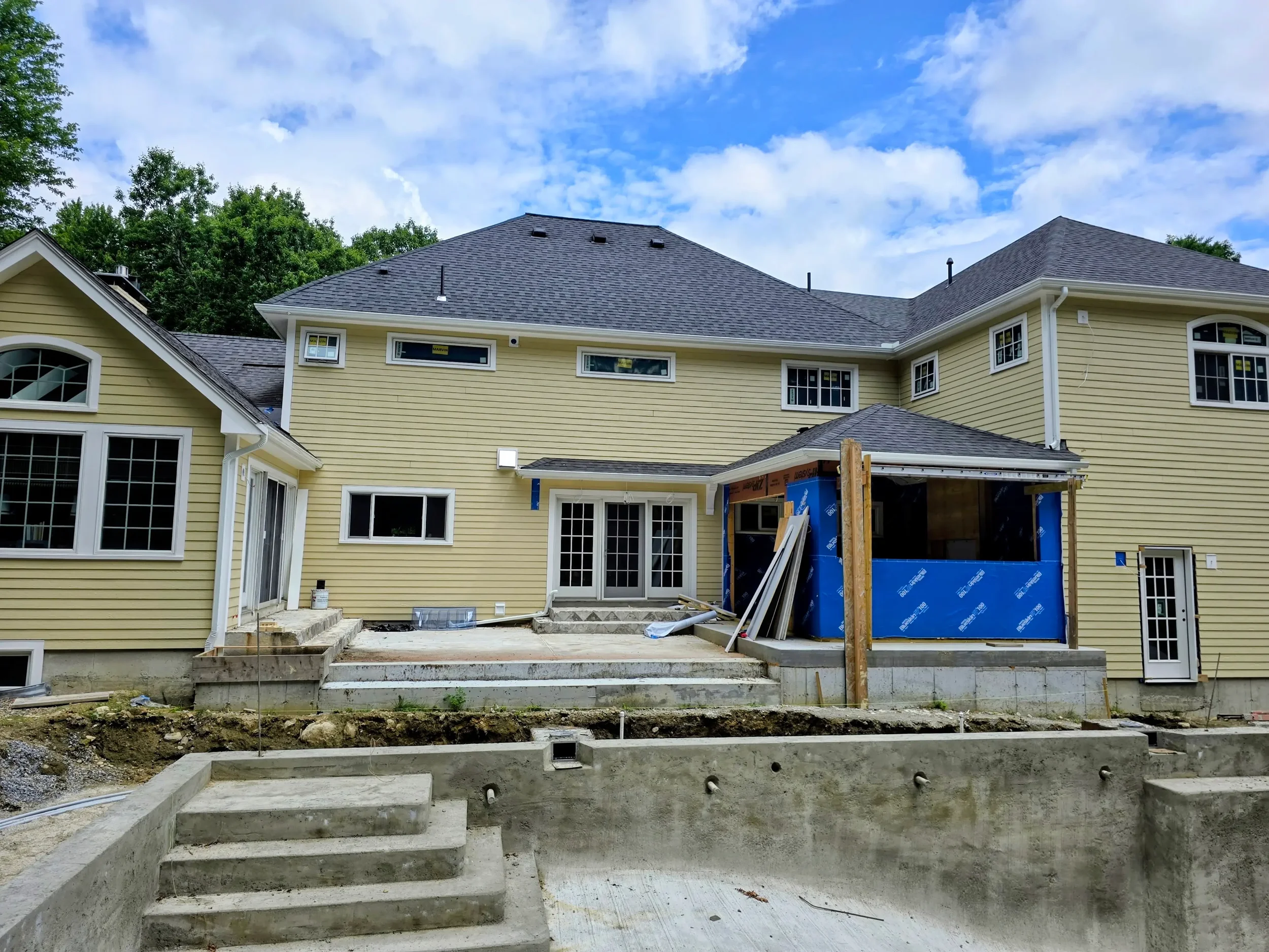 365ft of white 5-inch .032-gauge aluminum seamless gutters with hidden hangers, micro-mesh gutter screening, 2x3 downspouts, and (14) miters in Shrewsbury, MA | Royalty Gutters LLC