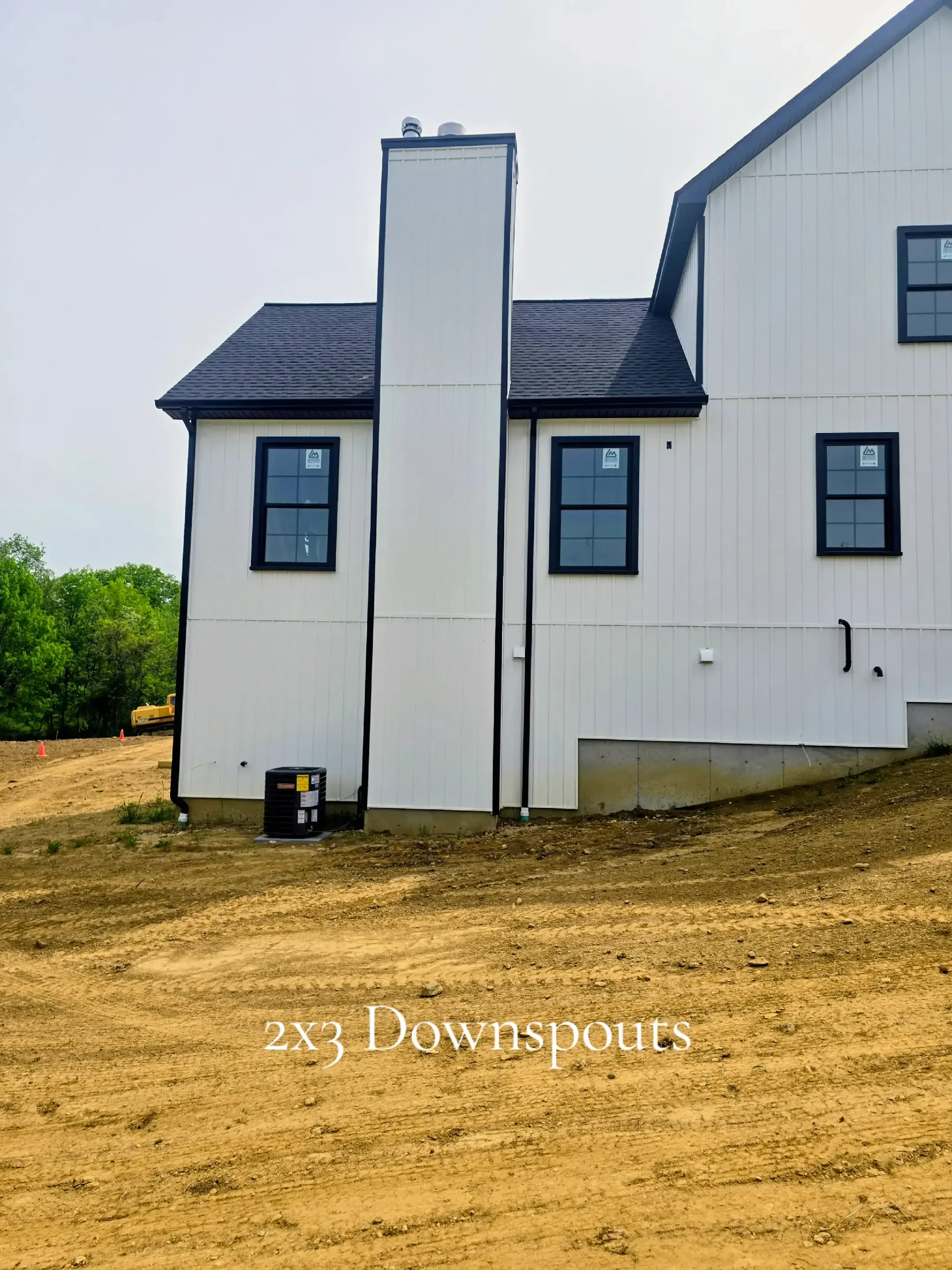  5" black .032-gauge aluminum seamless gutters Hidden hangers for superior strength and a clean finish Black 2x3 downspouts 2 custom inside miters in North Brookfield, MA Royalty Gutters LLC 2026