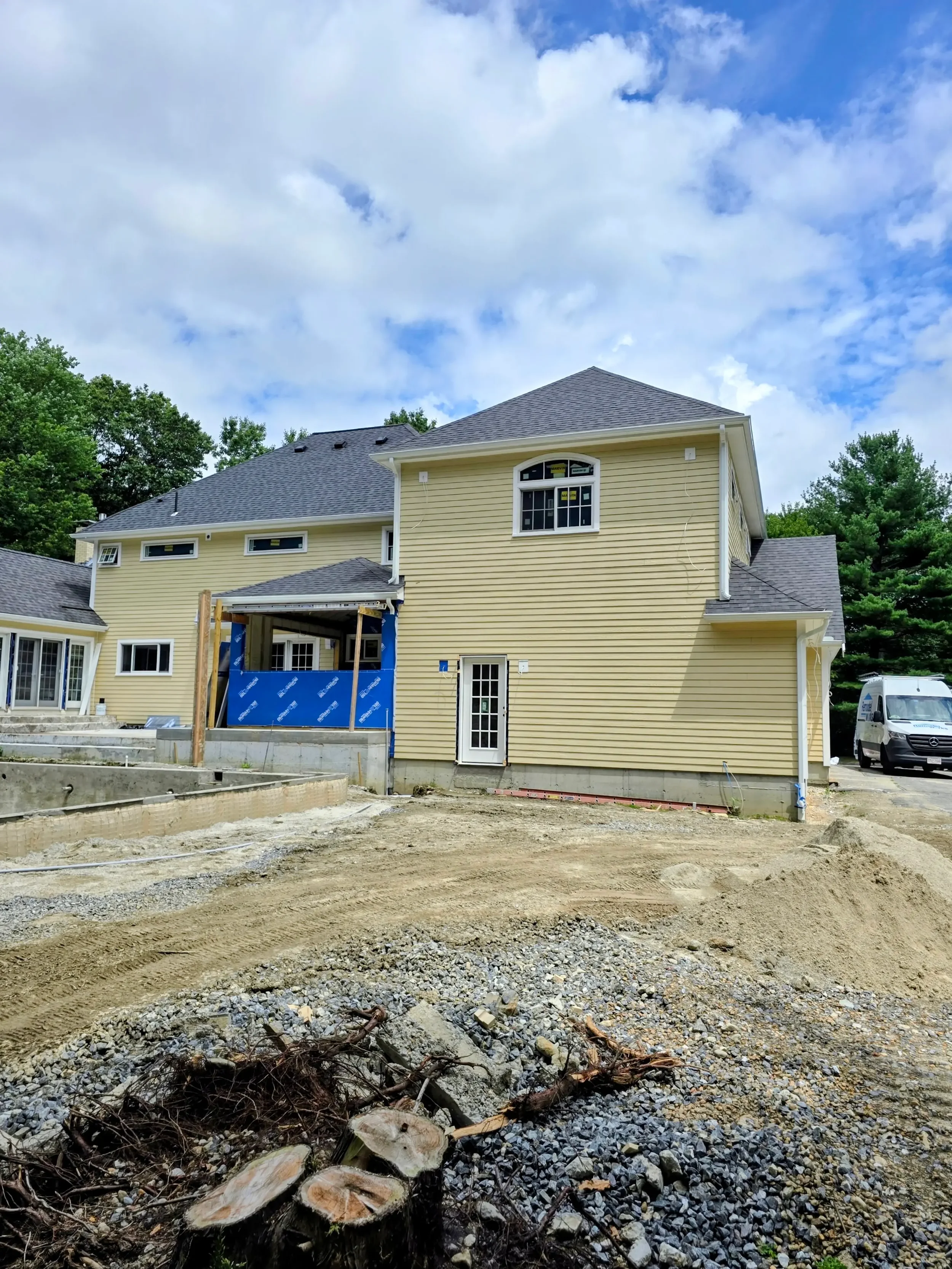 365ft of white 5-inch .032-gauge aluminum seamless gutters with hidden hangers, micro-mesh gutter screening, 2x3 downspouts, and (14) miters in Shrewsbury, MA | Royalty Gutters LLC