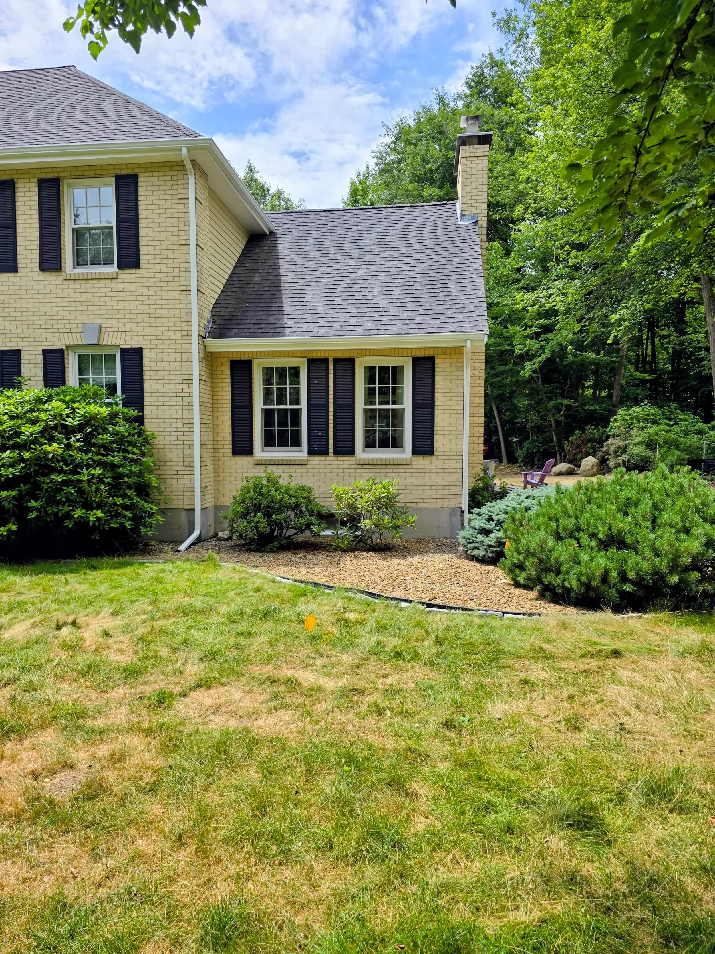 365ft of white 5-inch .032-gauge aluminum seamless gutters with hidden hangers, micro-mesh gutter screening, 2x3 downspouts, and (14) miters in Shrewsbury, MA | Royalty Gutters LLC