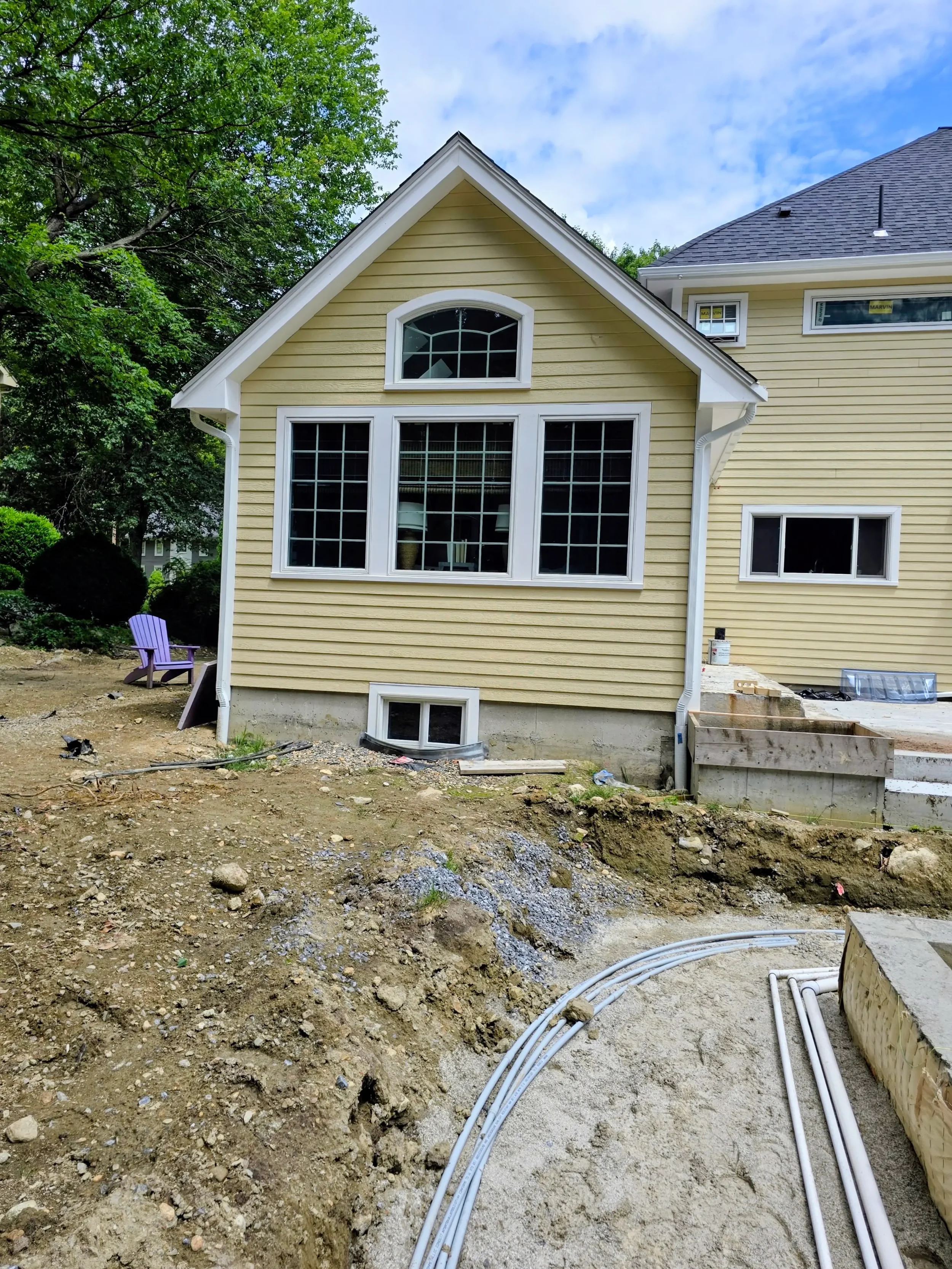 365ft of white 5-inch .032-gauge aluminum seamless gutters with hidden hangers, micro-mesh gutter screening, 2x3 downspouts, and (14) miters in Shrewsbury, MA | Royalty Gutters LLC