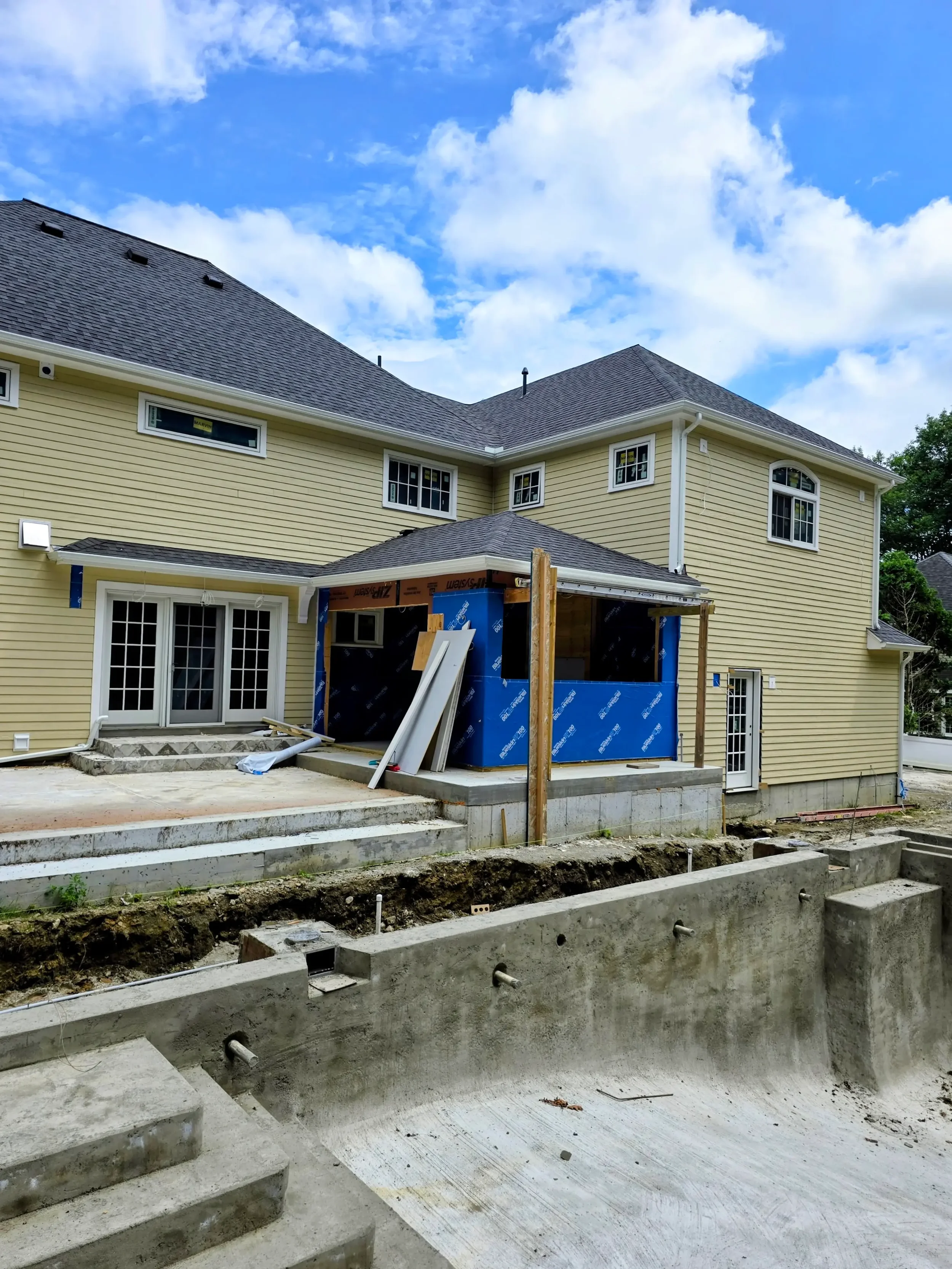 365ft of white 5-inch .032-gauge aluminum seamless gutters with hidden hangers, micro-mesh gutter screening, 2x3 downspouts, and (14) miters in Shrewsbury, MA | Royalty Gutters LLC