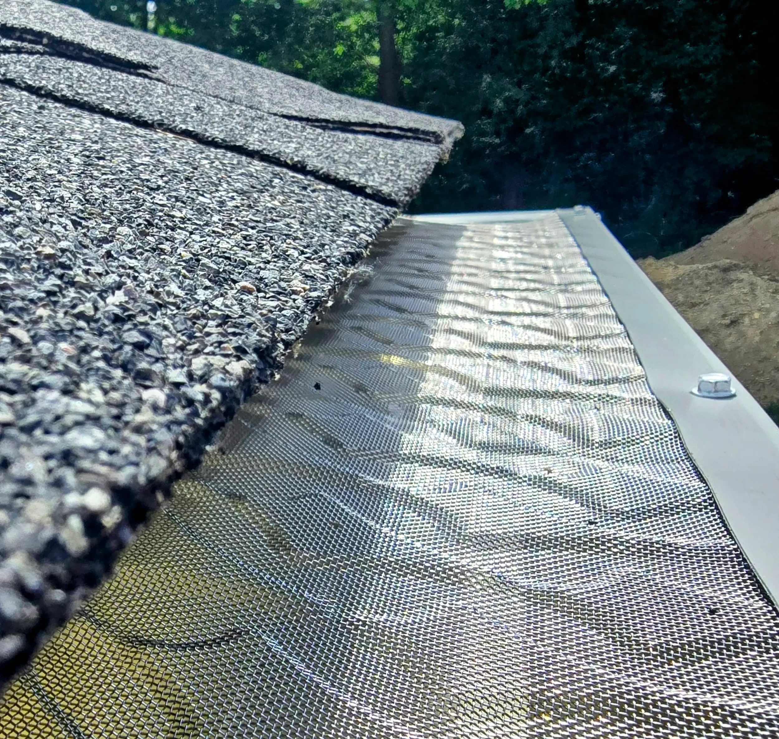 365ft of white 5-inch .032-gauge aluminum seamless gutters with hidden hangers, micro-mesh gutter screening, 2x3 downspouts, and (14) miters in Shrewsbury, MA | Royalty Gutters LLC