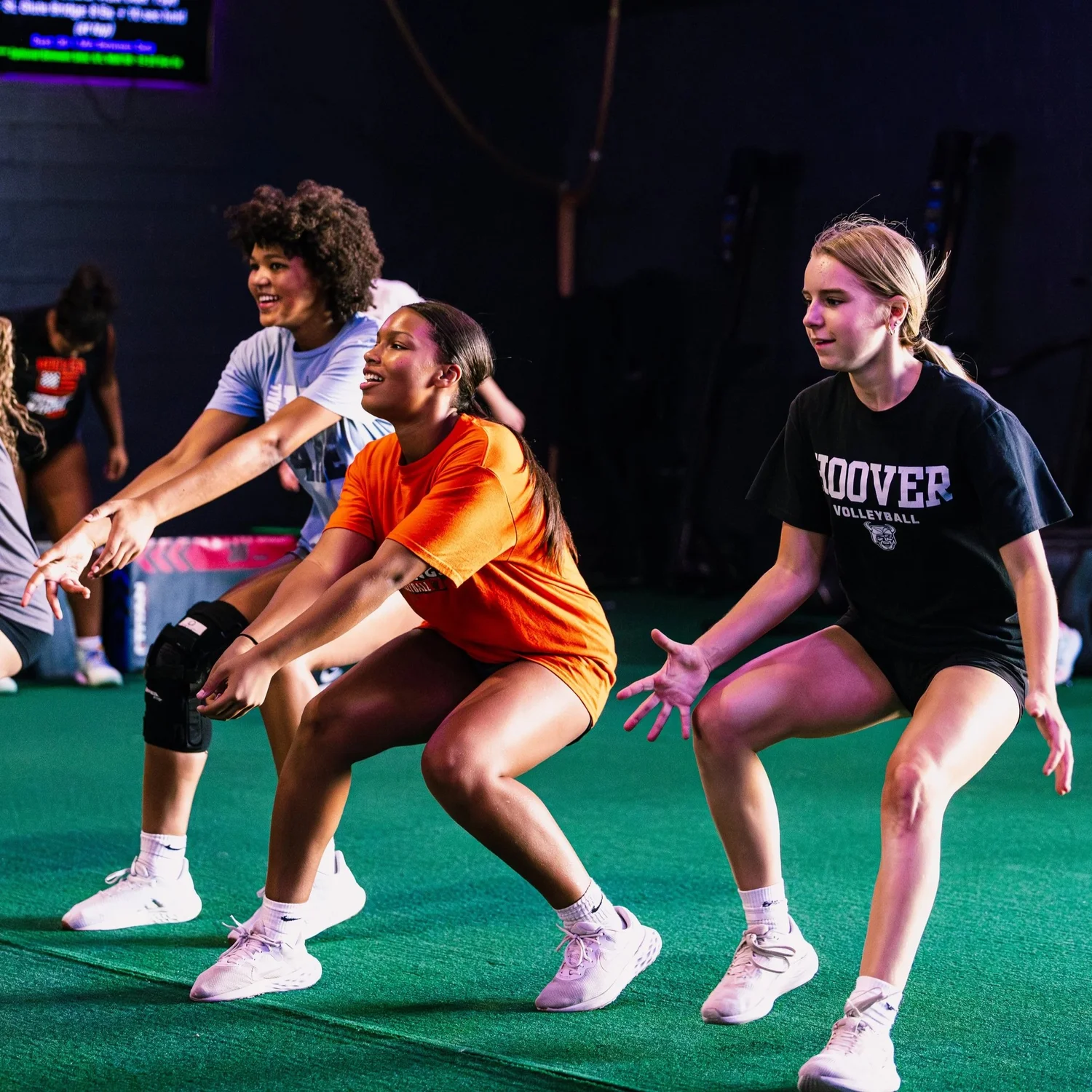 Young athletes training on the turf