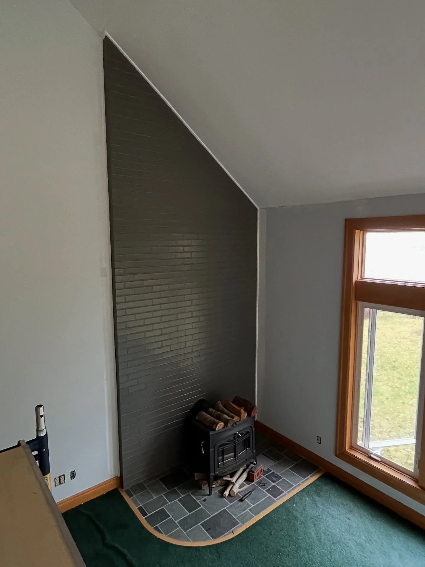 Transforming the fireplace as part of a whole house transformation including all new paint, new hardwood floors, whole exterior solid stain and deck repair and staining.