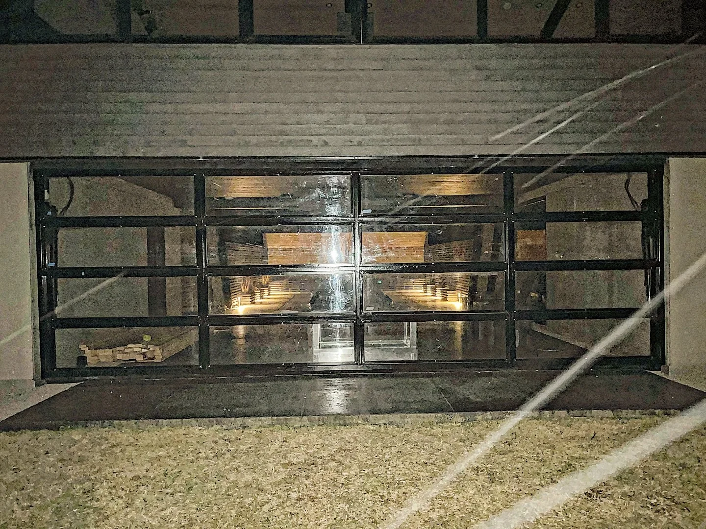 Finally completed the last install of brackets/windows last night in the freezing cold and blowing snow. You can see the snow flying past the camera lense. This airplane hanger door restoration started in the last warm days of October. Weather sudden