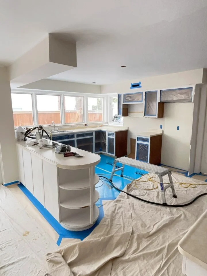 Spraying two coats of shellac primer today, sanding between coats. Grain filling the old oak with layers of primer. Countertops are being replaced - reason why they are not masked..