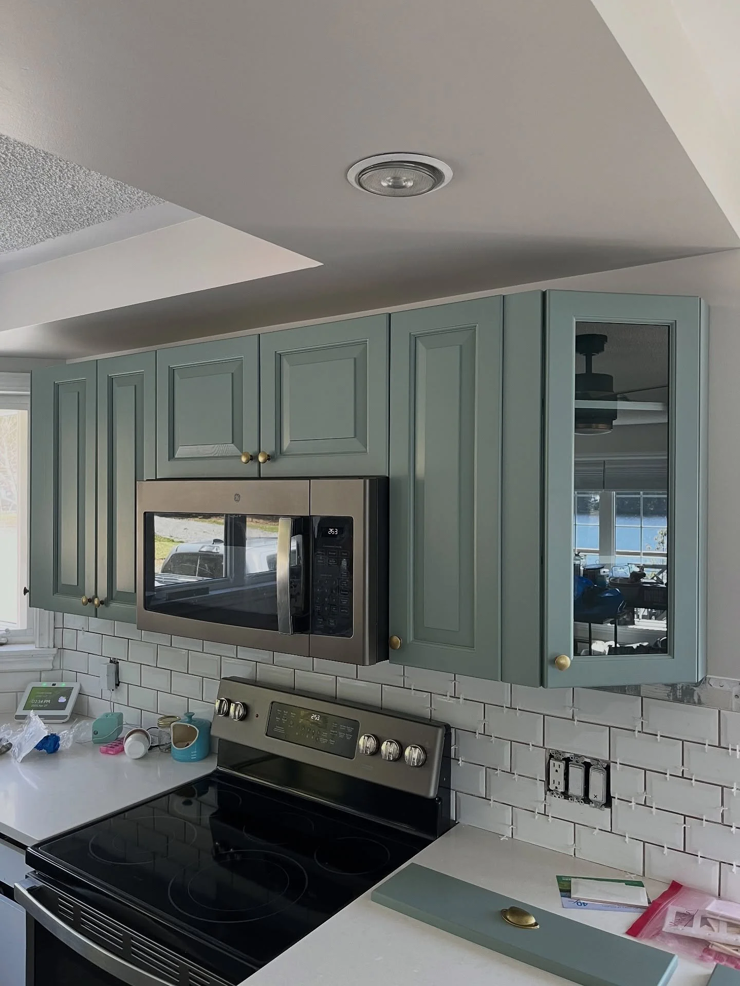 Reinstalling doors on another kitchen cabinet makeover