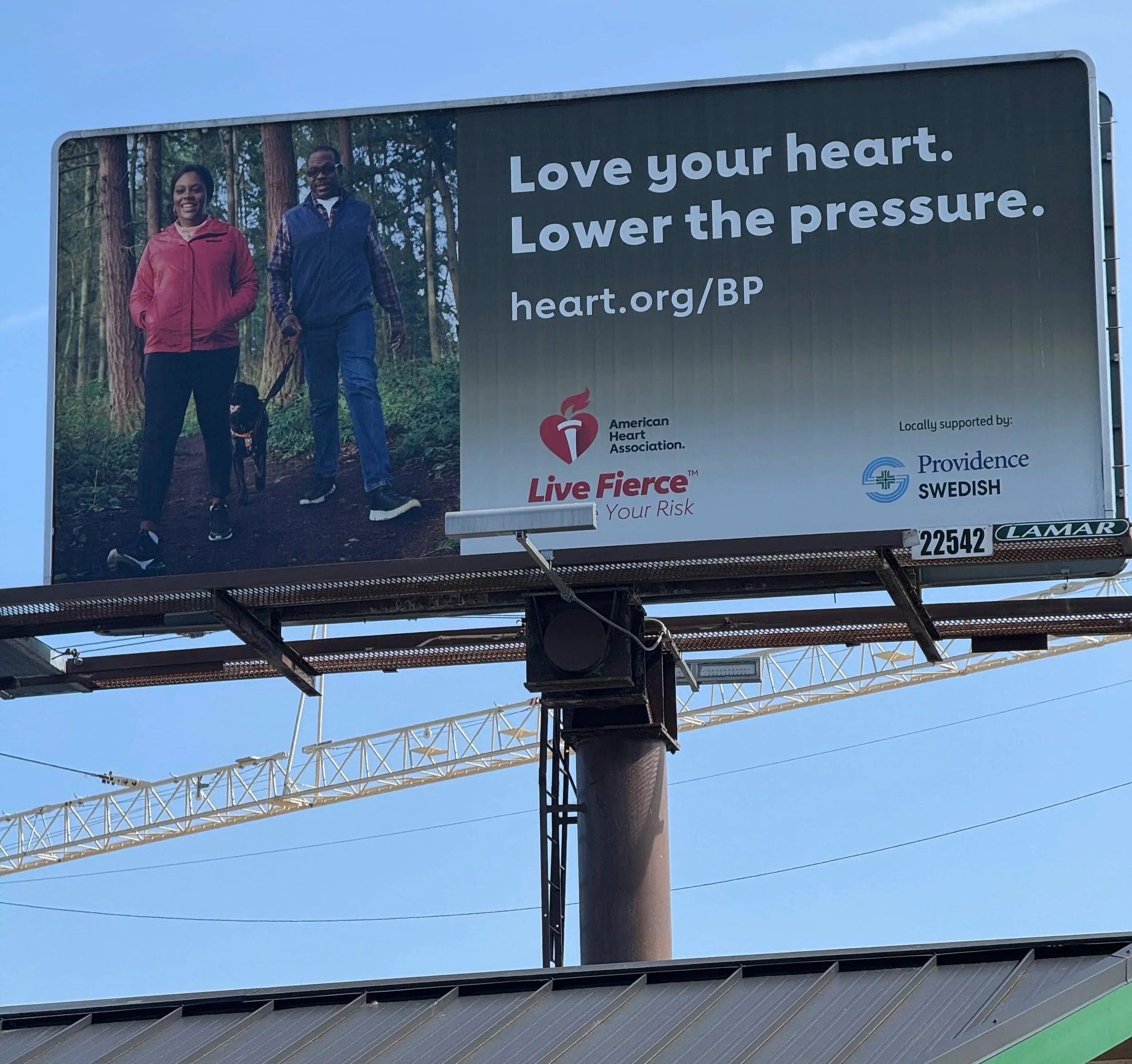 Executive Allure founder featured on billboard for AHA “Love Your Heart” Campaign, 2025.