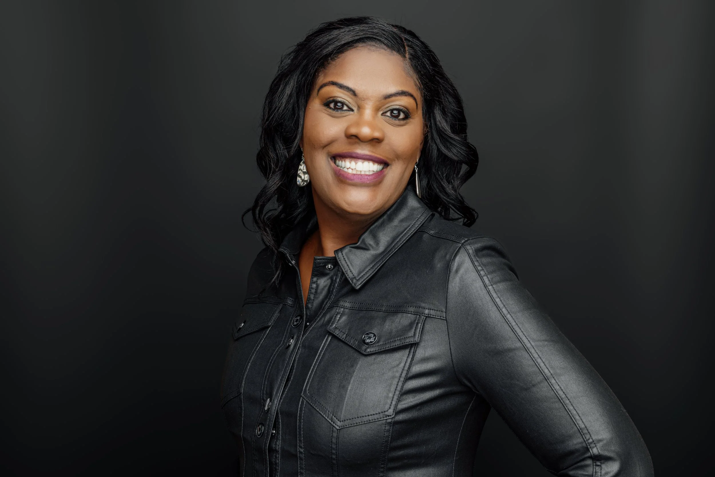 Monique working at her desk, providing strategic partnership and high-touch support for leaders.