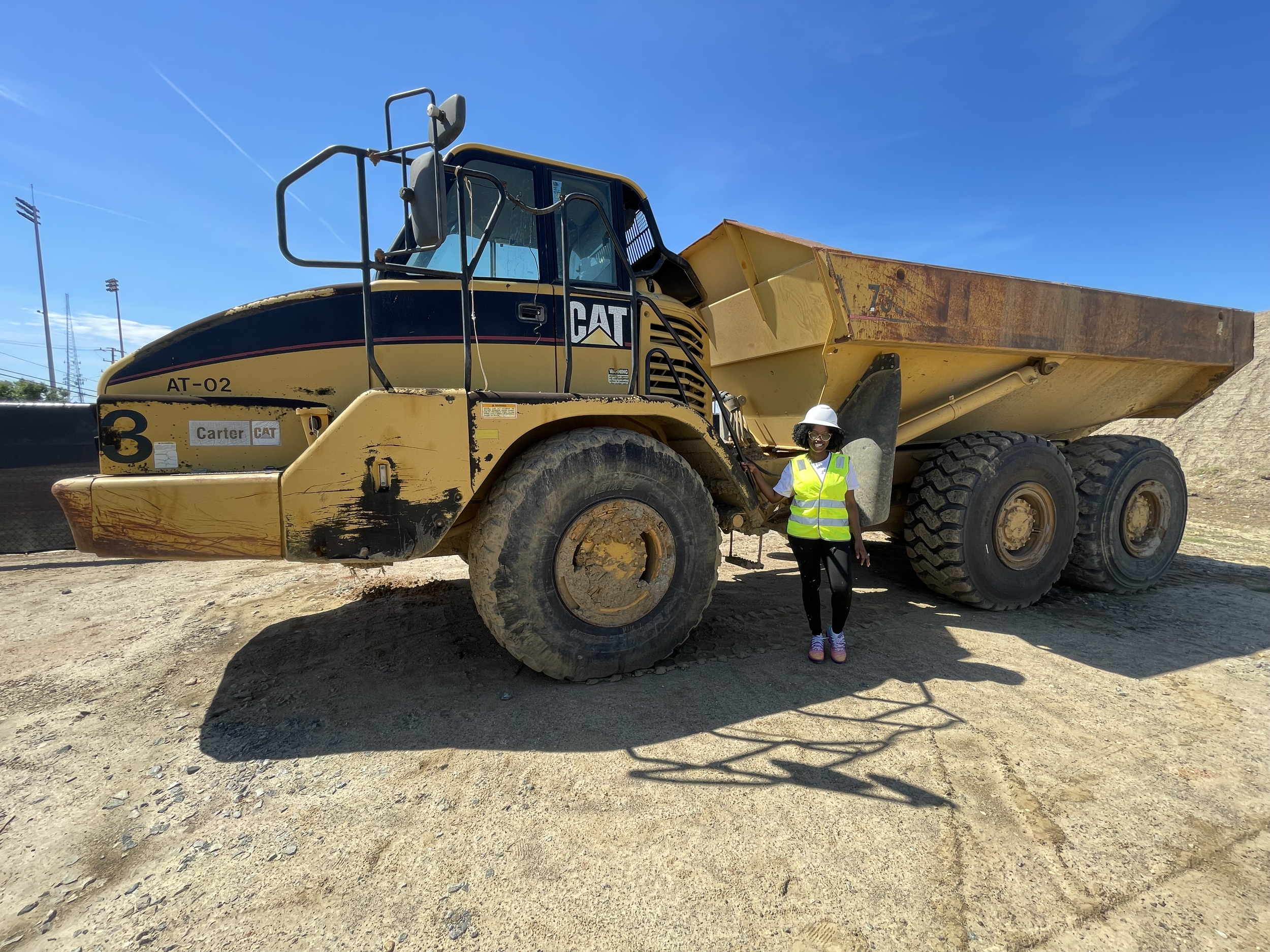 C&B team member with articulated dump truck on construction site