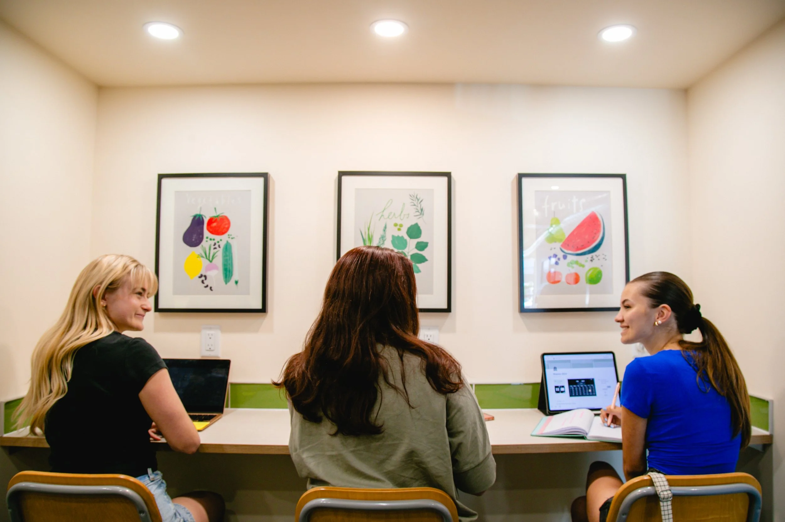 Three women enjoying lunch together at Cowork Chilliwack