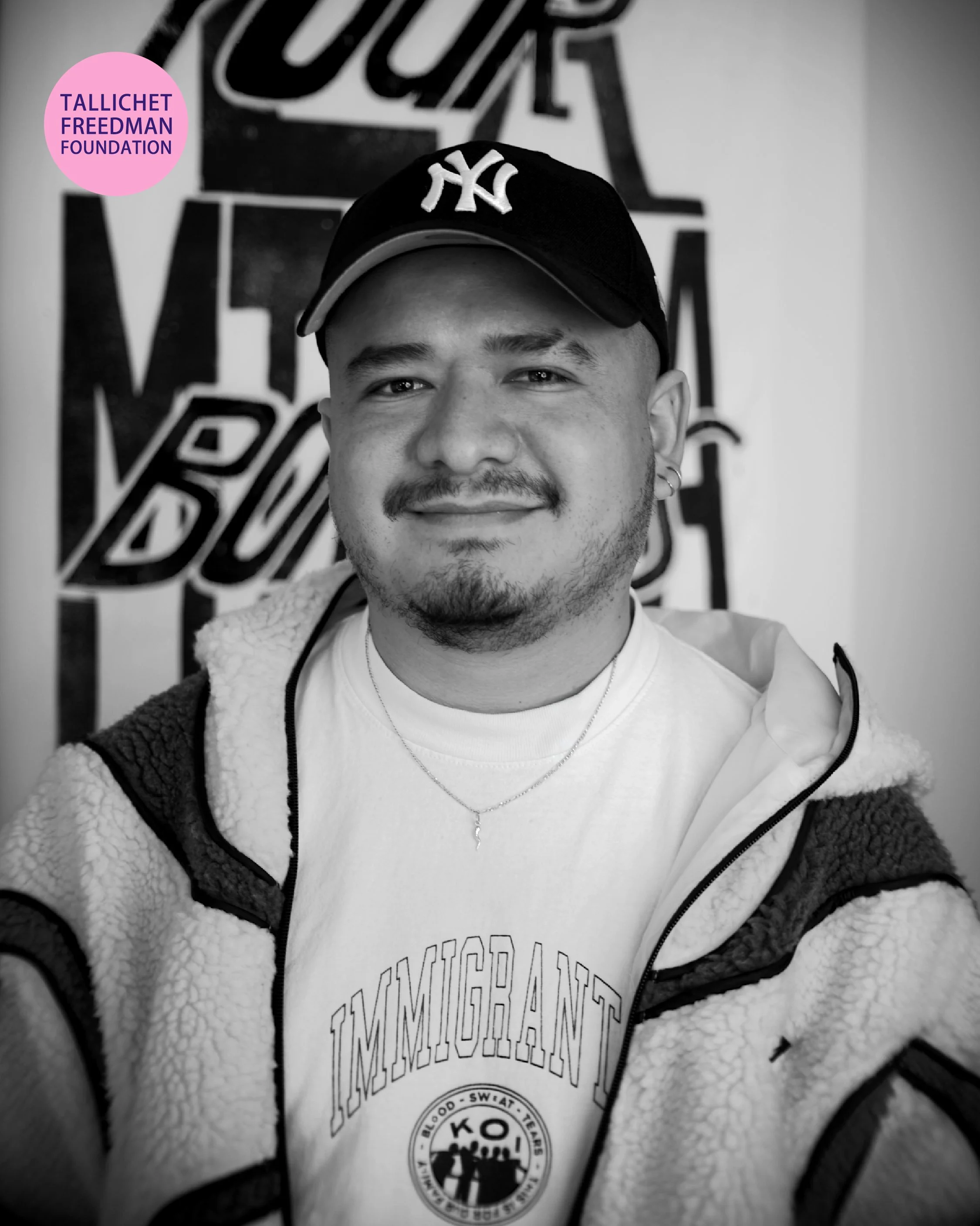 Queens artist Ricardo Aca in a close-up portrait during a filmed studio interview discussing their artistic practice.