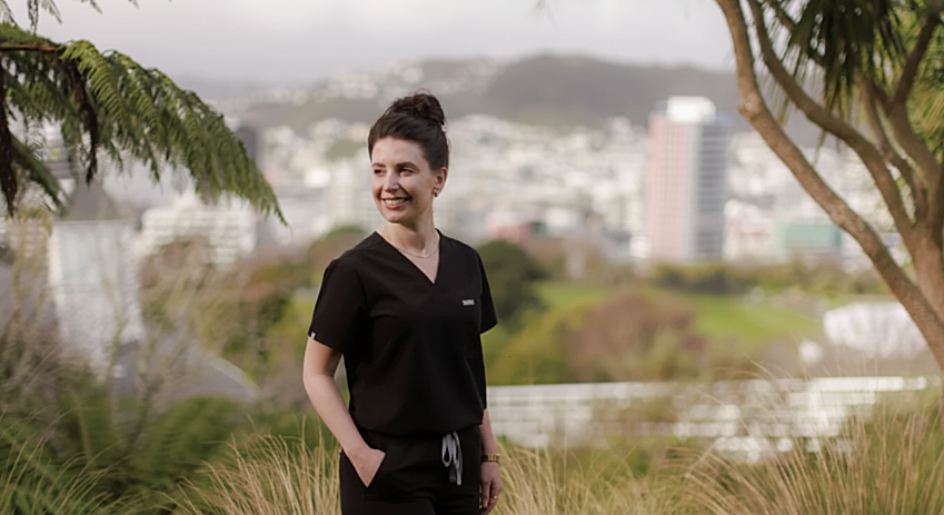 Dr Jessica Harris, dental sleep medicine clinician in Wellington, standing outdoors overlooking Kelburn