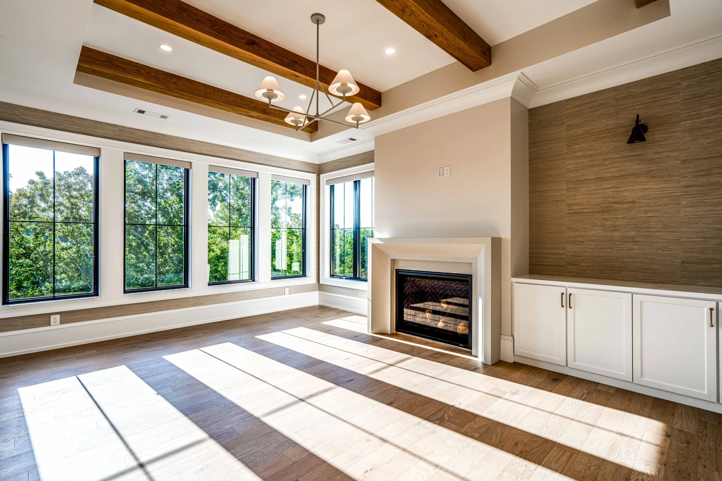 Luxury award wining home in milton ga manor by ADG Custom Homes  grasscloth owners suite and fireplace, white oak beams and flooring.jpg