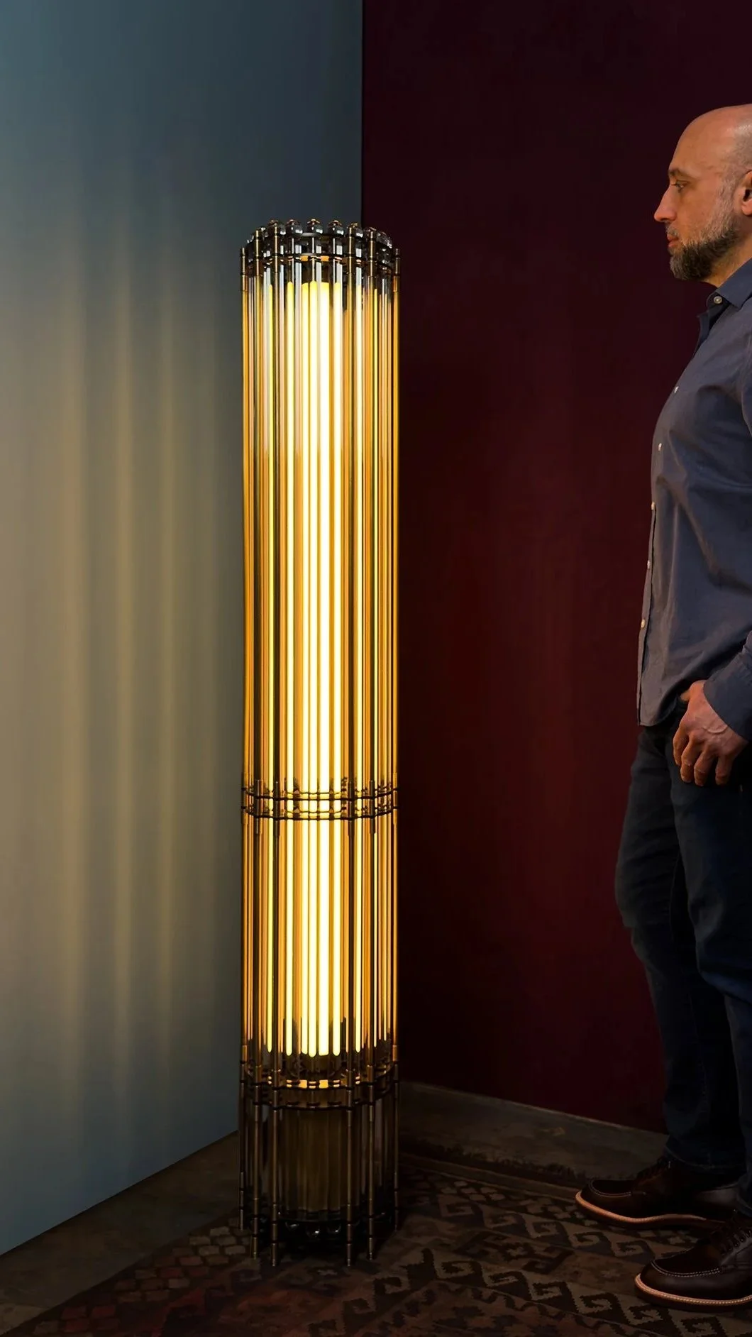 Tower Floor Lamp by Neptune Glassworks—floor-mounted fixture with stacked glass rods and machined brass plates, crowned with optical nodes that shimmer with light. Handcrafted in Los Angeles.