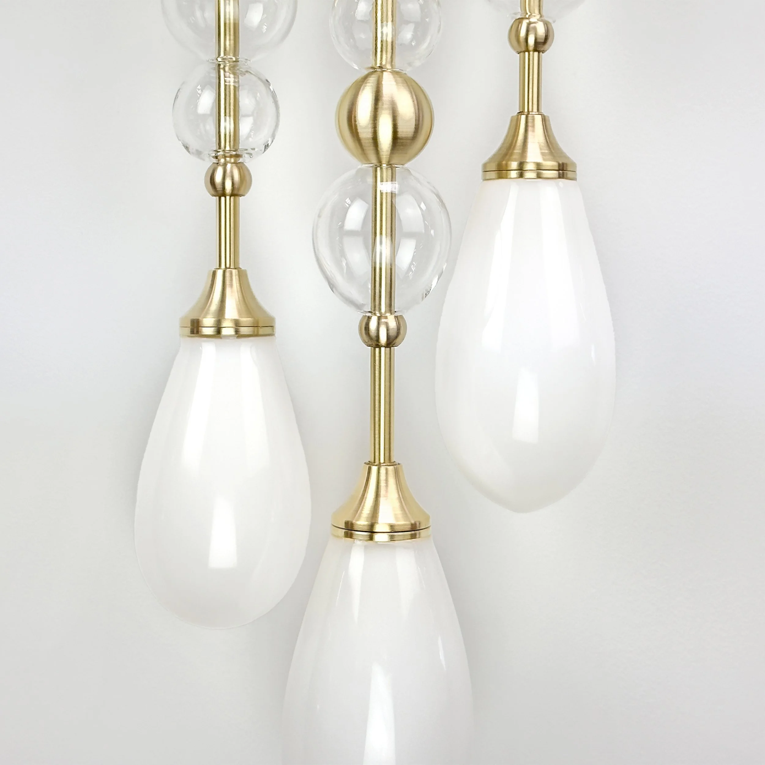 Buoyancy Sconce by Neptune Glassworks—wall-mounted sculptural lighting with hand-blown glass bubbles and brass elements, balancing playfulness and refinement. Handcrafted in Los Angeles.