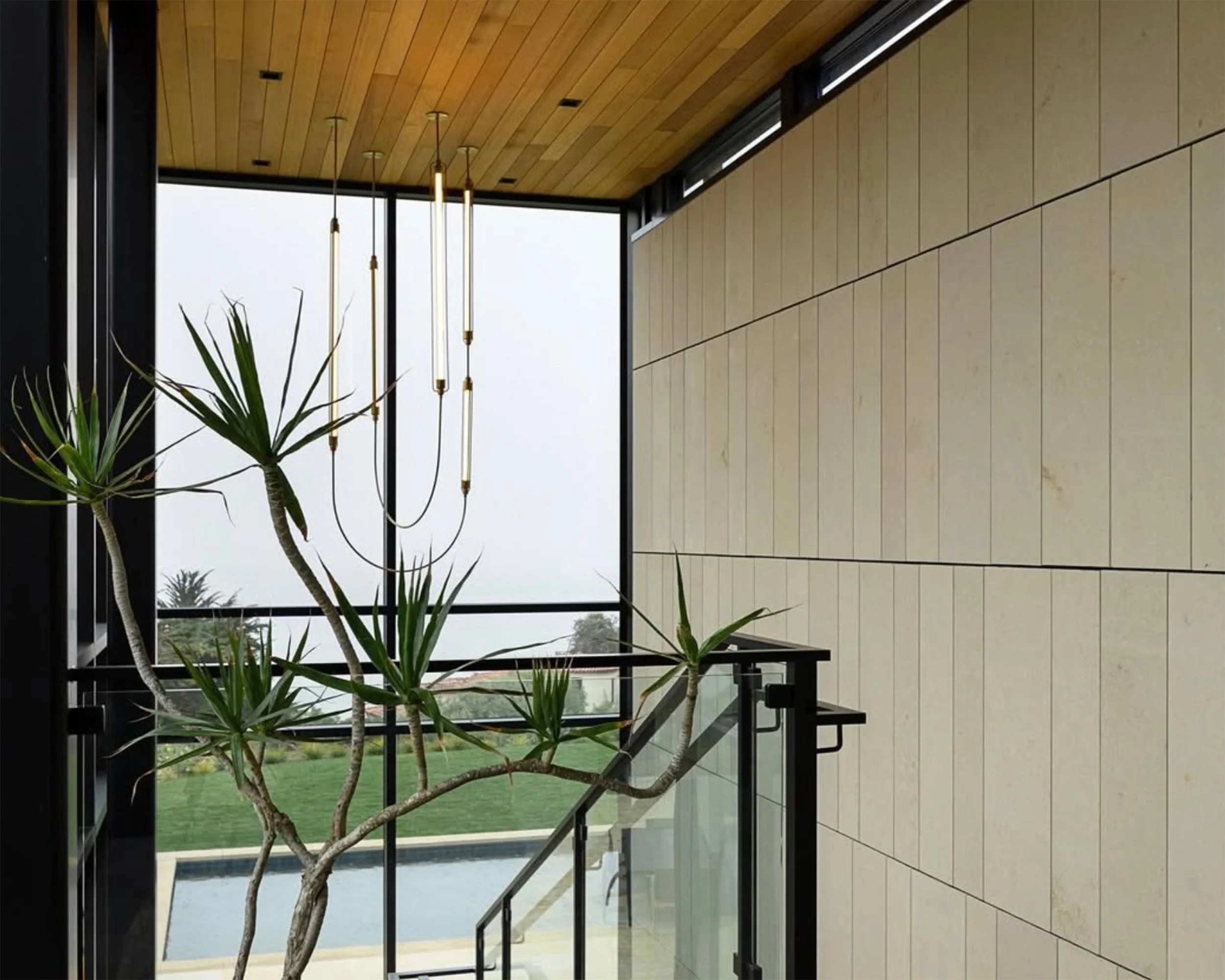 Harp Necklace Chandelier by Neptune Glassworks—sculptural lighting composition featuring exposed Harp Modules arranged like a luminous chain. Handcrafted in Los Angeles.