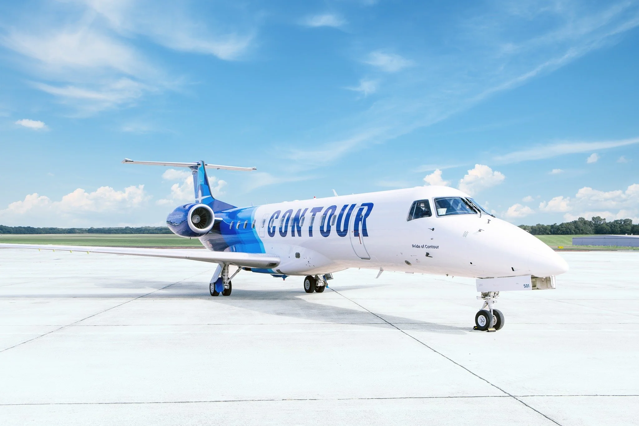 Contour Airlines regional jet parked on airport tarmac under a clear blue sky, representing new commercial air service connecting Ruidoso to Denver.