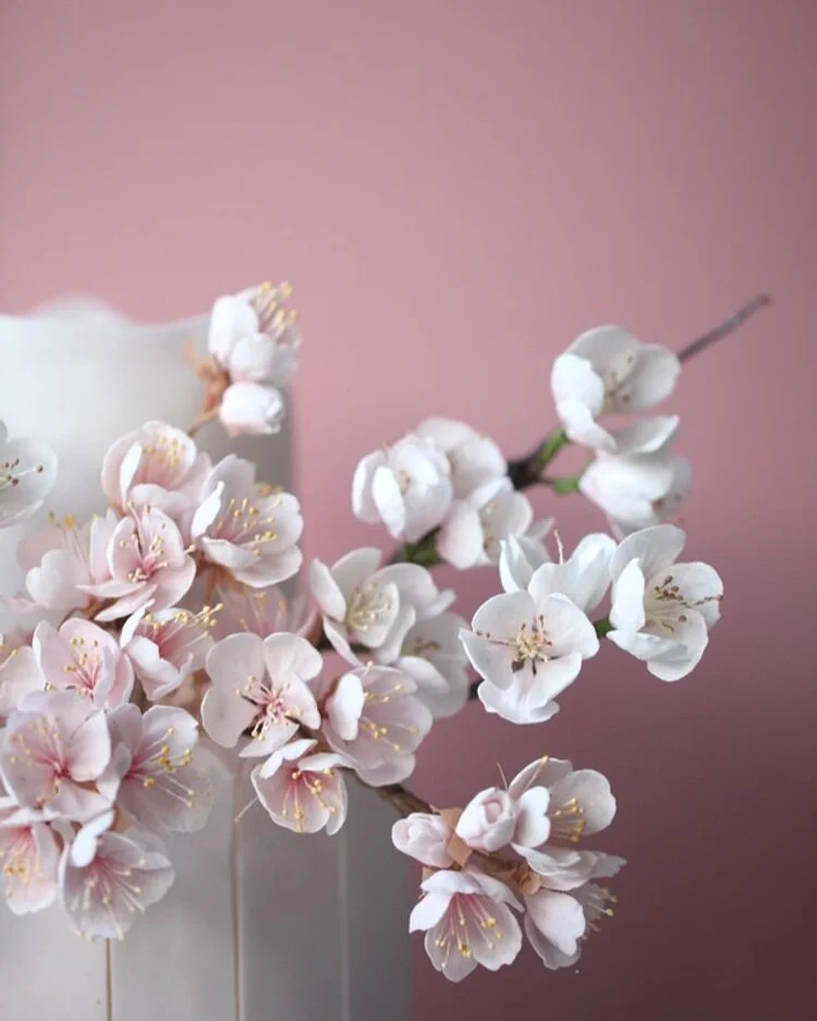small wedding cake with hand made sugar cherry blossom