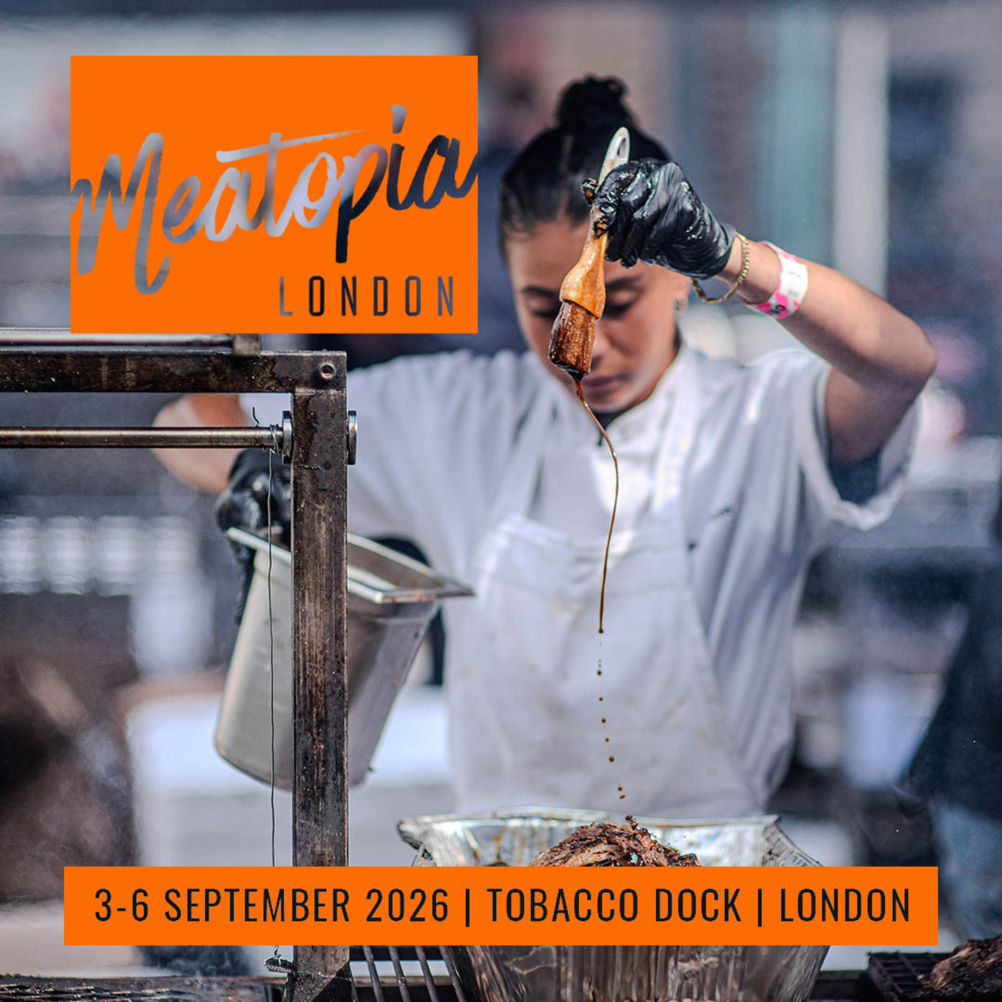 A promotional event poster for Meatopia London, showing a chef in a white coat and black gloves basting meat over a grill. The Meatopia London logo appears in an orange box in the upper left. An orange banner at the bottom reads: '3–6 September 2026 