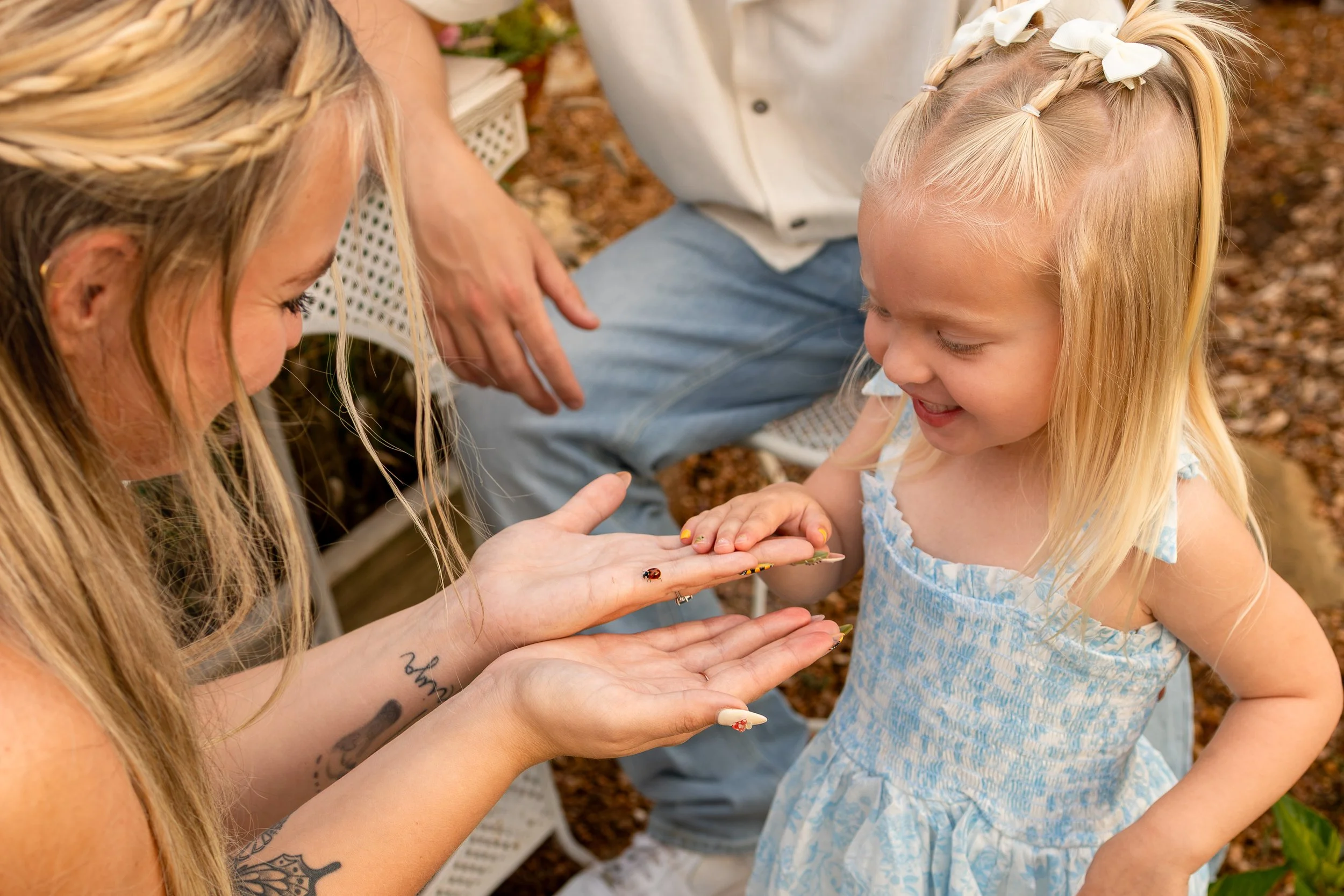 candid moment during family photo session at a flower farm near wichita kansas