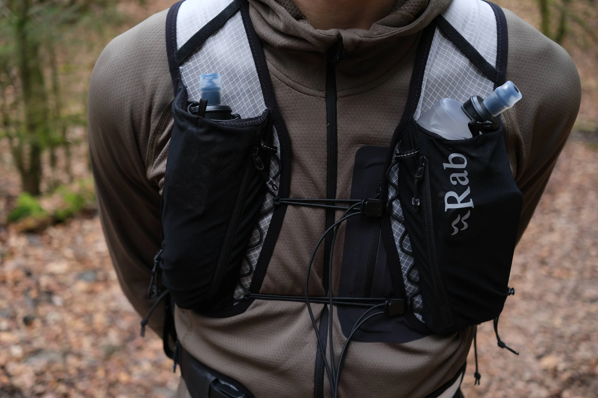 Front view of the pack with the 2 flasks and zippered pockets.