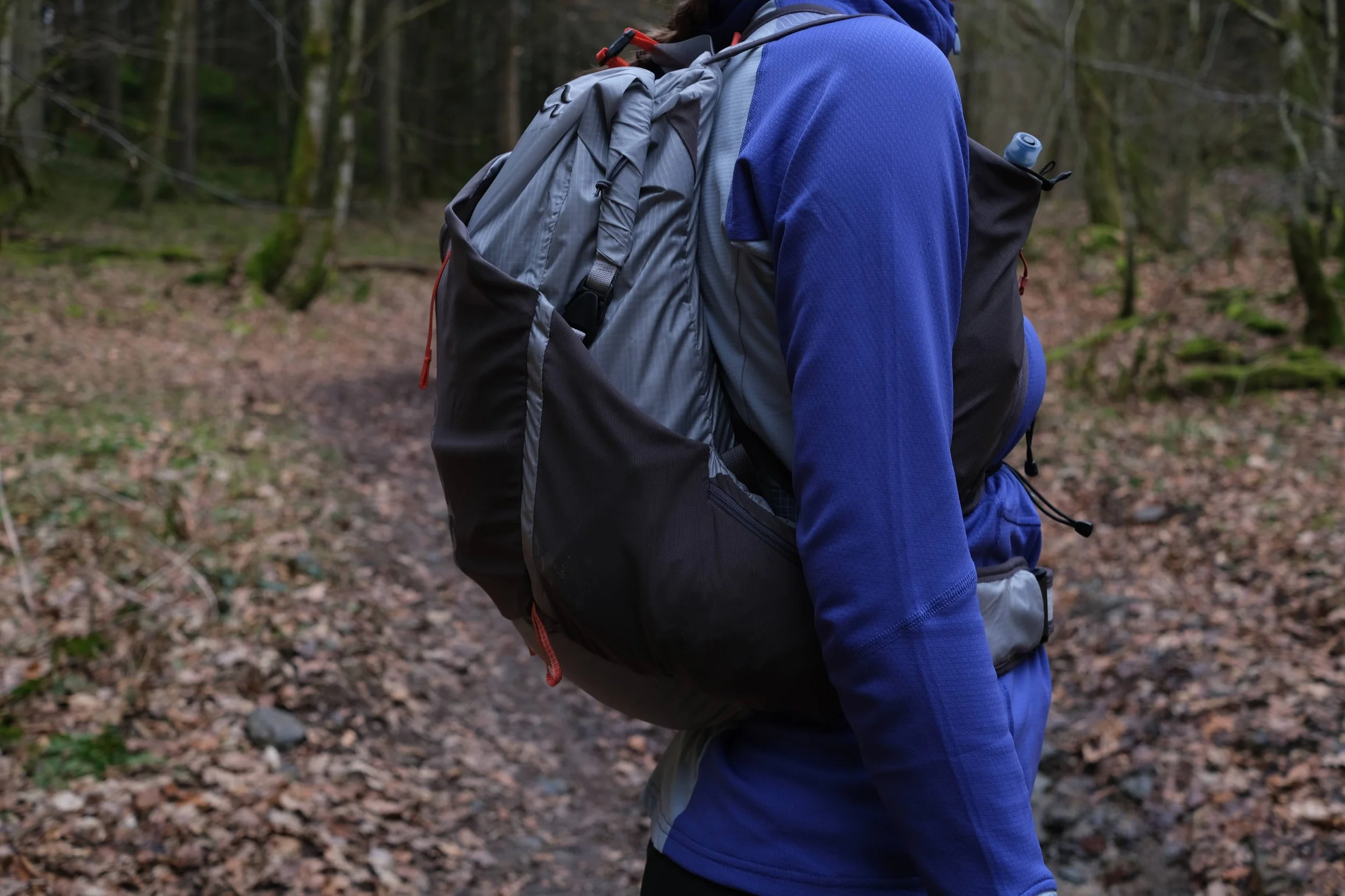 One side of the bag has both a mesh stash pocket and a zippered pocket on the side