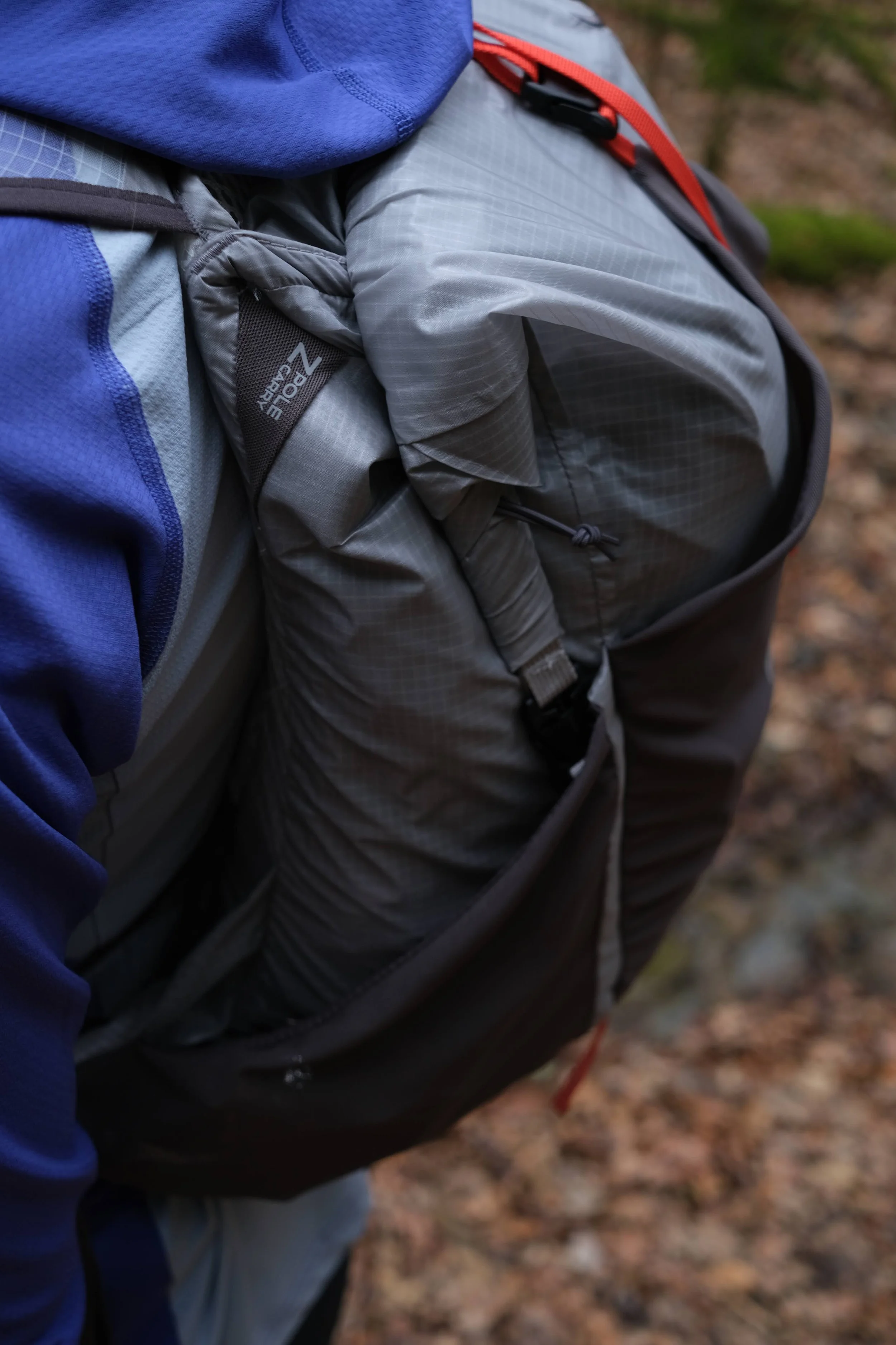 The left side of the pack has a large stash pocket and a place to store a trekking pole. 