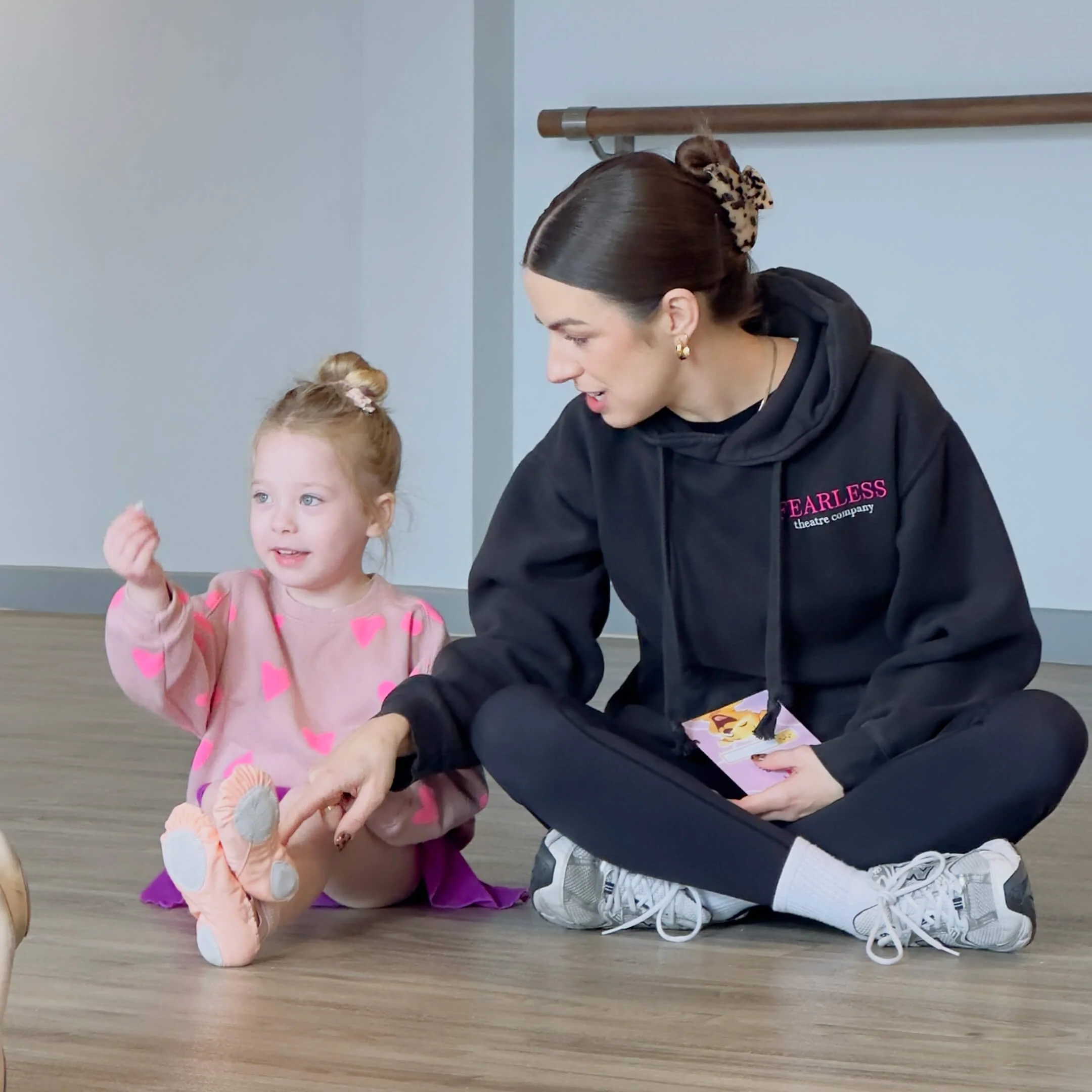 Teacher encouraging a young student during class