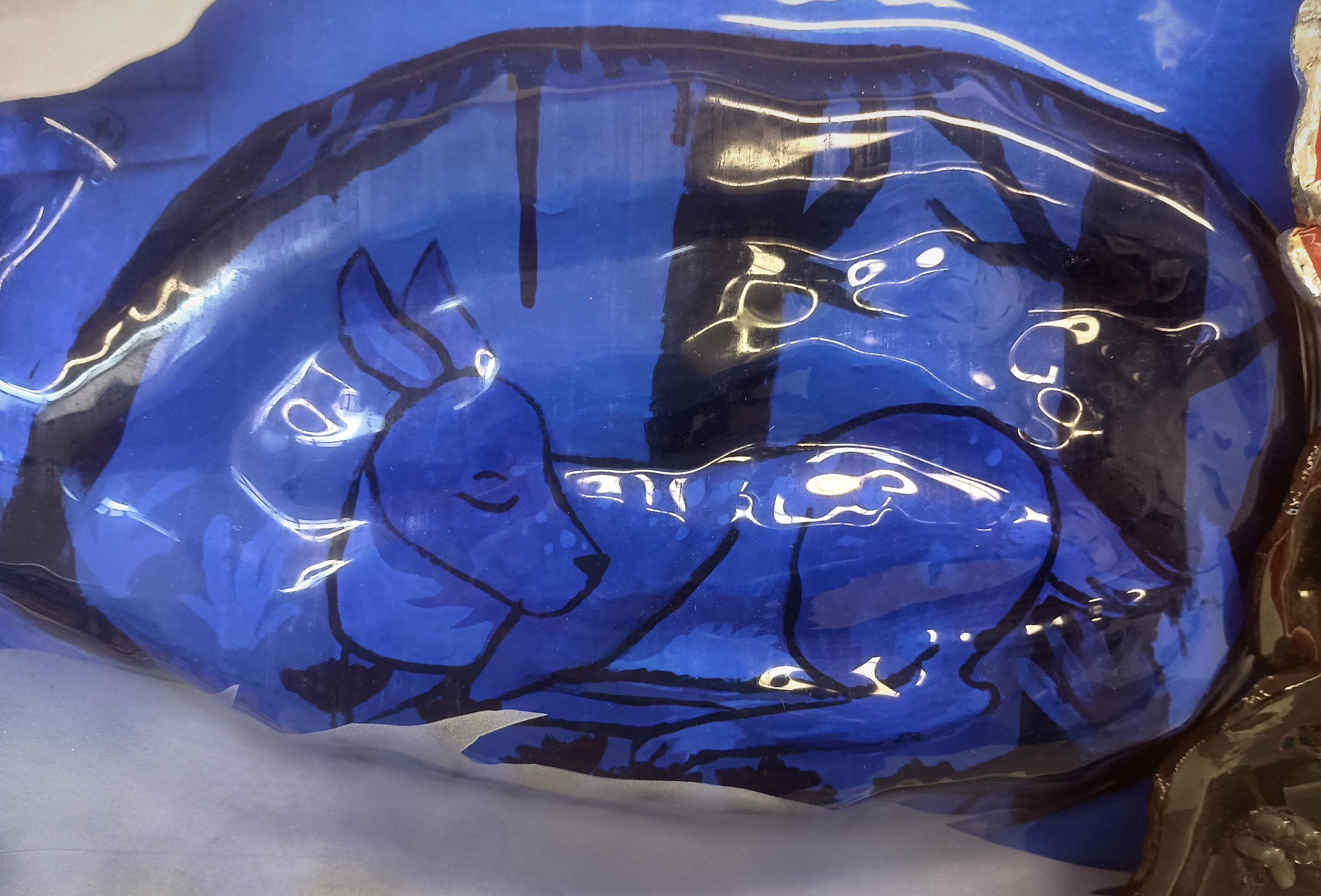 Beauty in Gore Detail; glass, lead solder, copper chain, acrylic paint, 2025