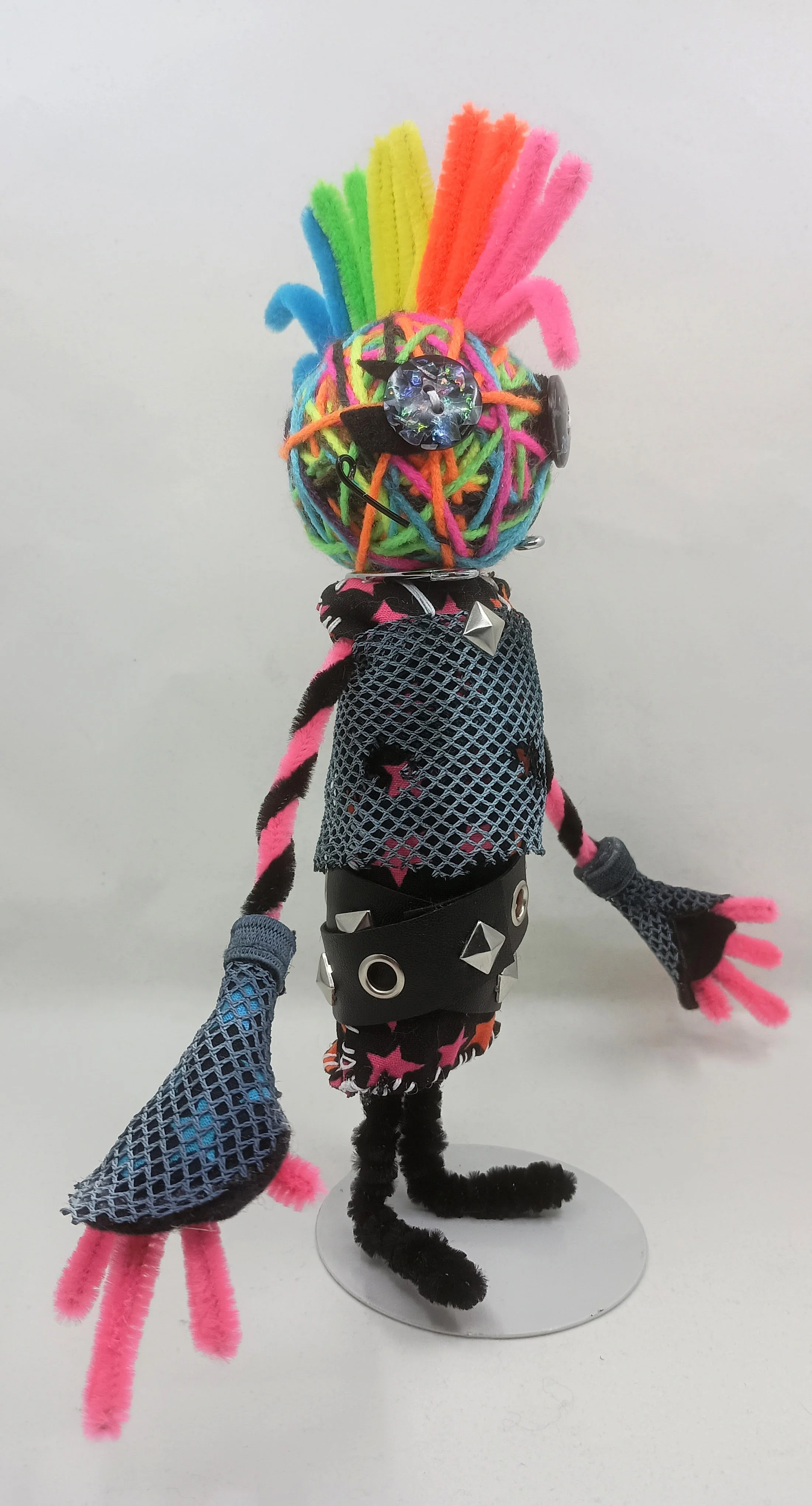Glamrock Omni Doll, yarn, pipe cleaners, buttons, mesh, faux leather ribbon, 2025