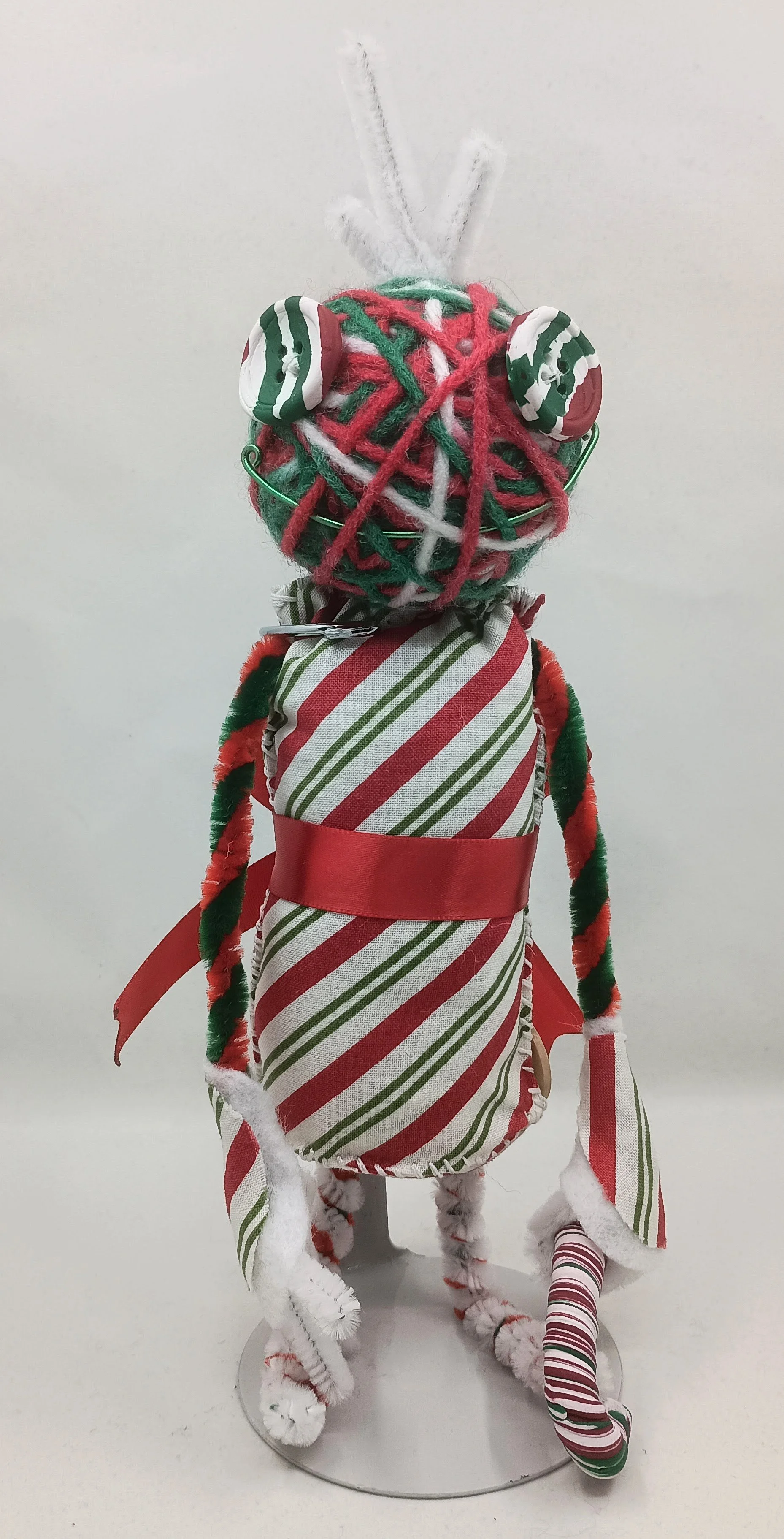 Candy Cane Omni Doll, yarn, pipe cleaners, felt, polymer clay, 2024