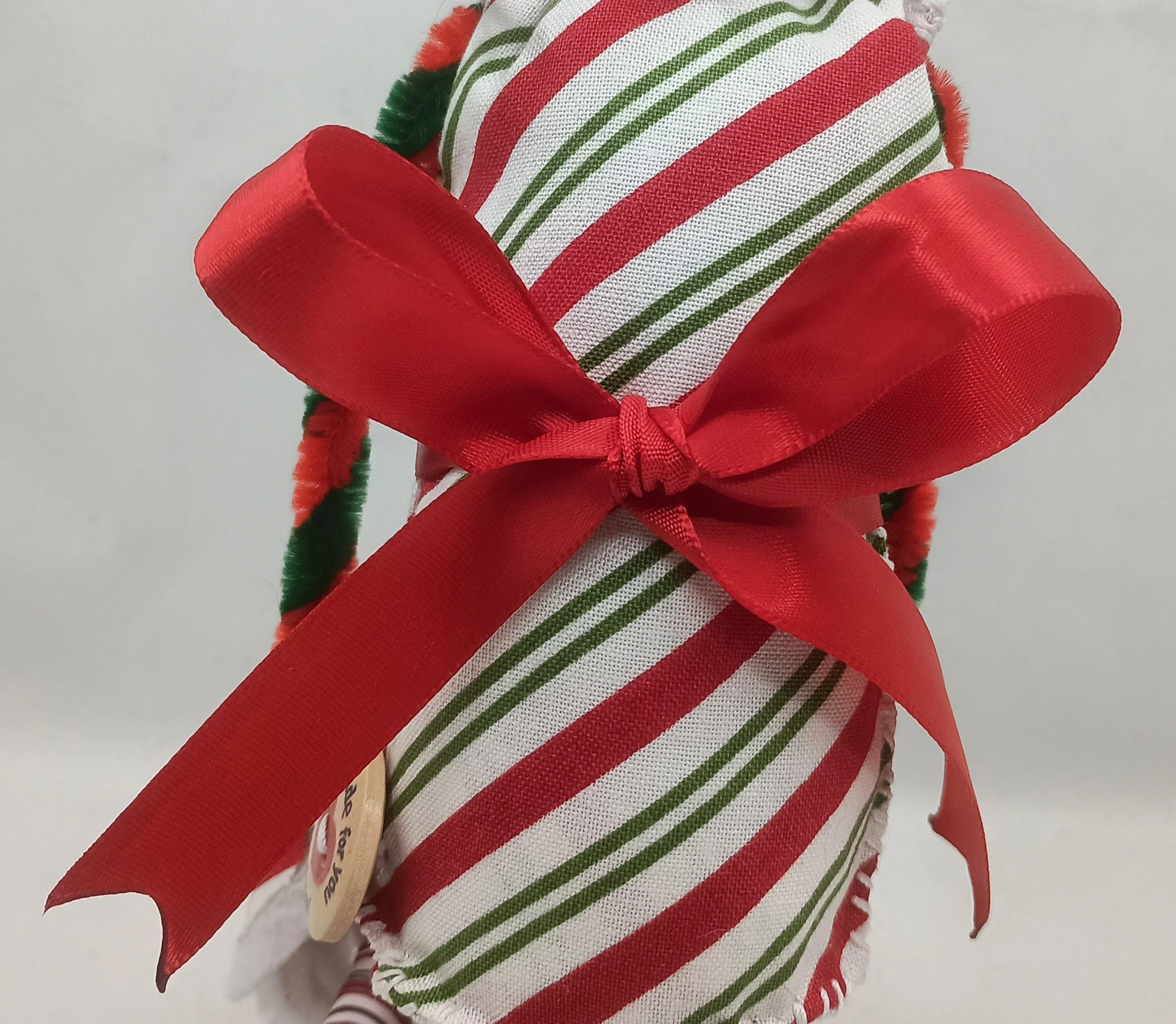 Candy Cane Omni Doll Detail, yarn, pipe cleaners, felt, polymer clay, 2024