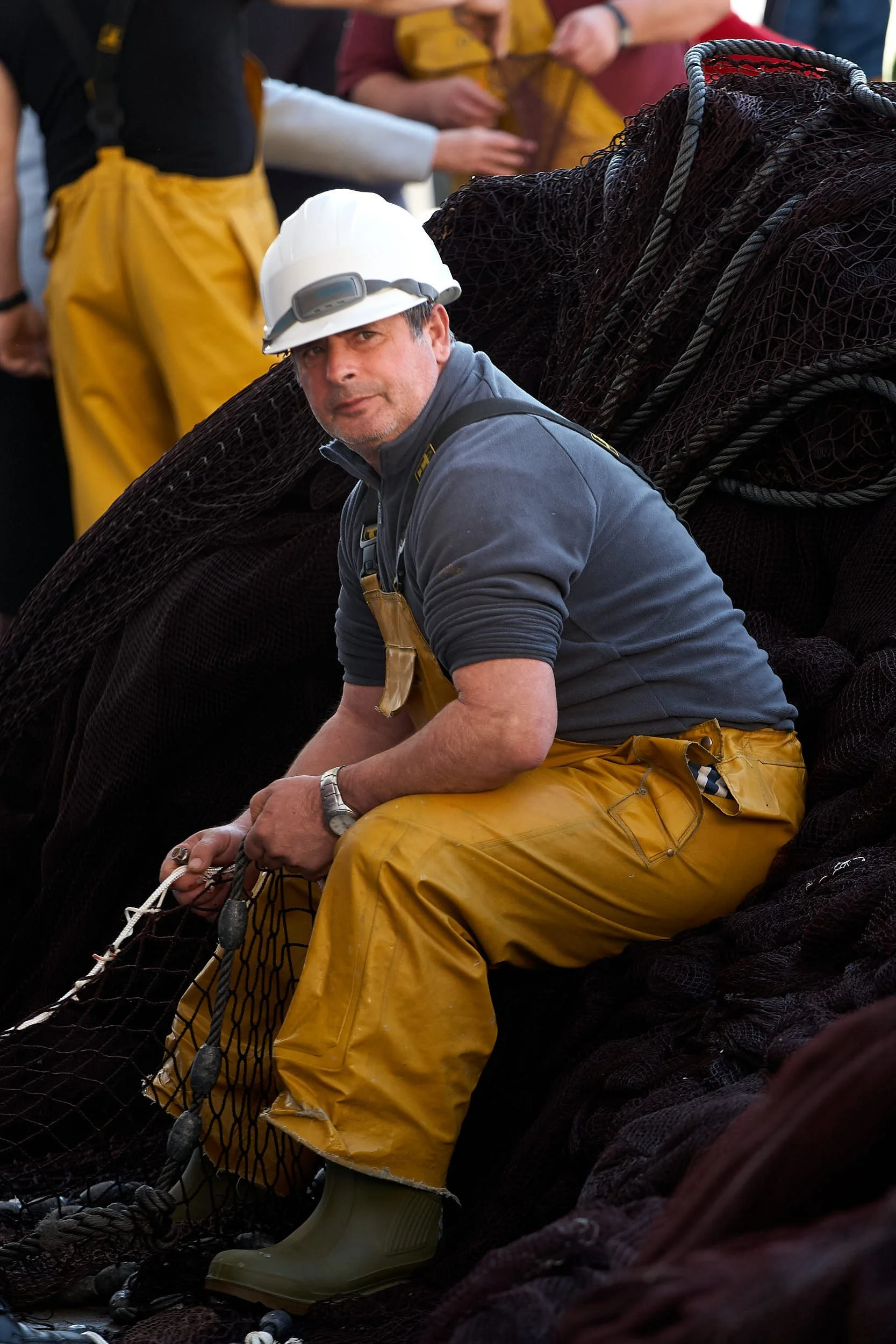 March 2011. Fisherman repairs nets in harbour, San Sebastián (Donostia), Gipuzkoa, Spain. Photo by James Sturcke | sturcke.org
