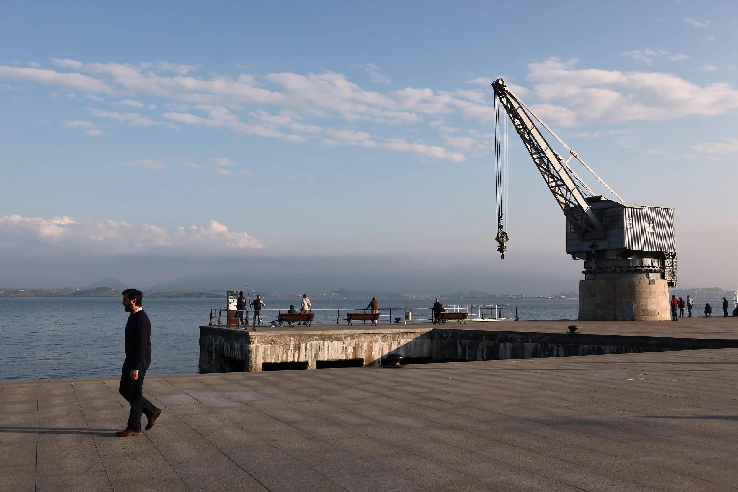 Man walking on quayside, Santander, Cantabria. Photo by James Sturcke 