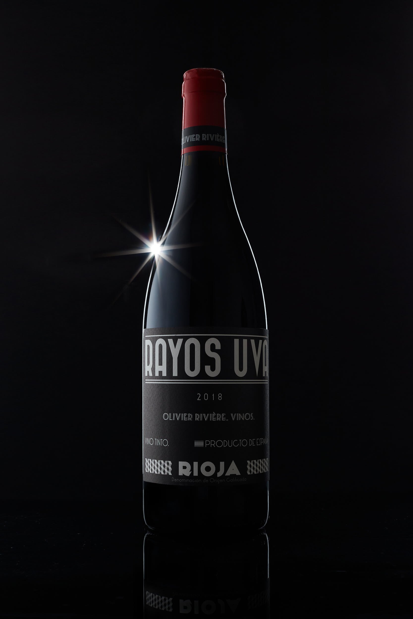 Grape Rays. Photograph of wine bottles in Logroño, La Rioja, Spain. Photo by James Sturcke | sturcke.org